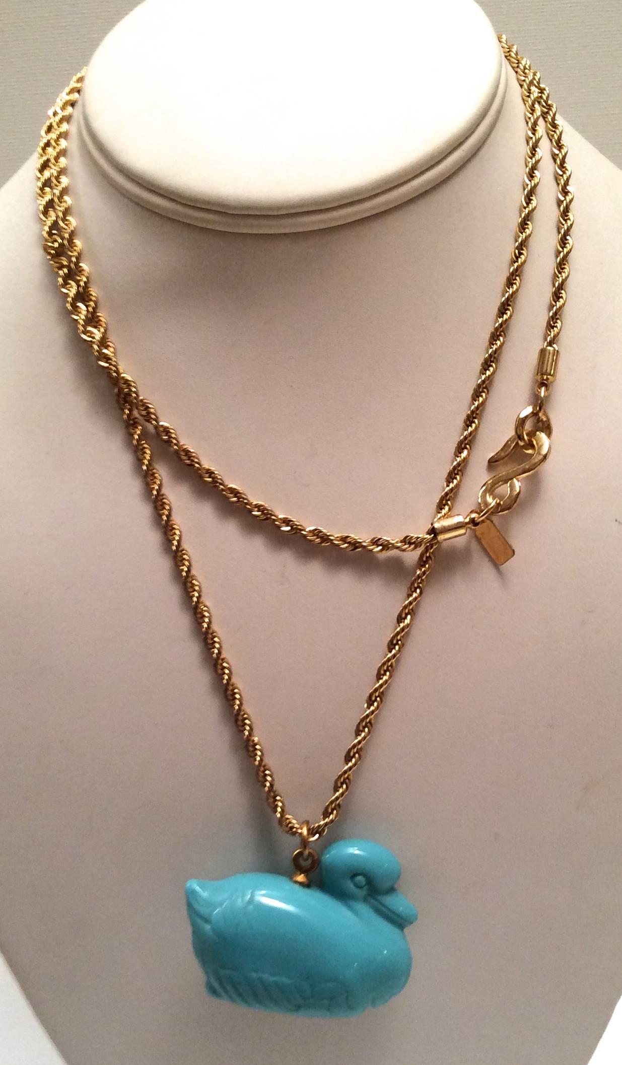 This new adorable KJL necklace is a fun little addition to any wardrobe. The gold tone chain is signed Kenneth J Lane. The necklace measures 30 inches. The duck is 2 inches long and 1.5 inches high from the head, and the body of the duck is 1 inch. 