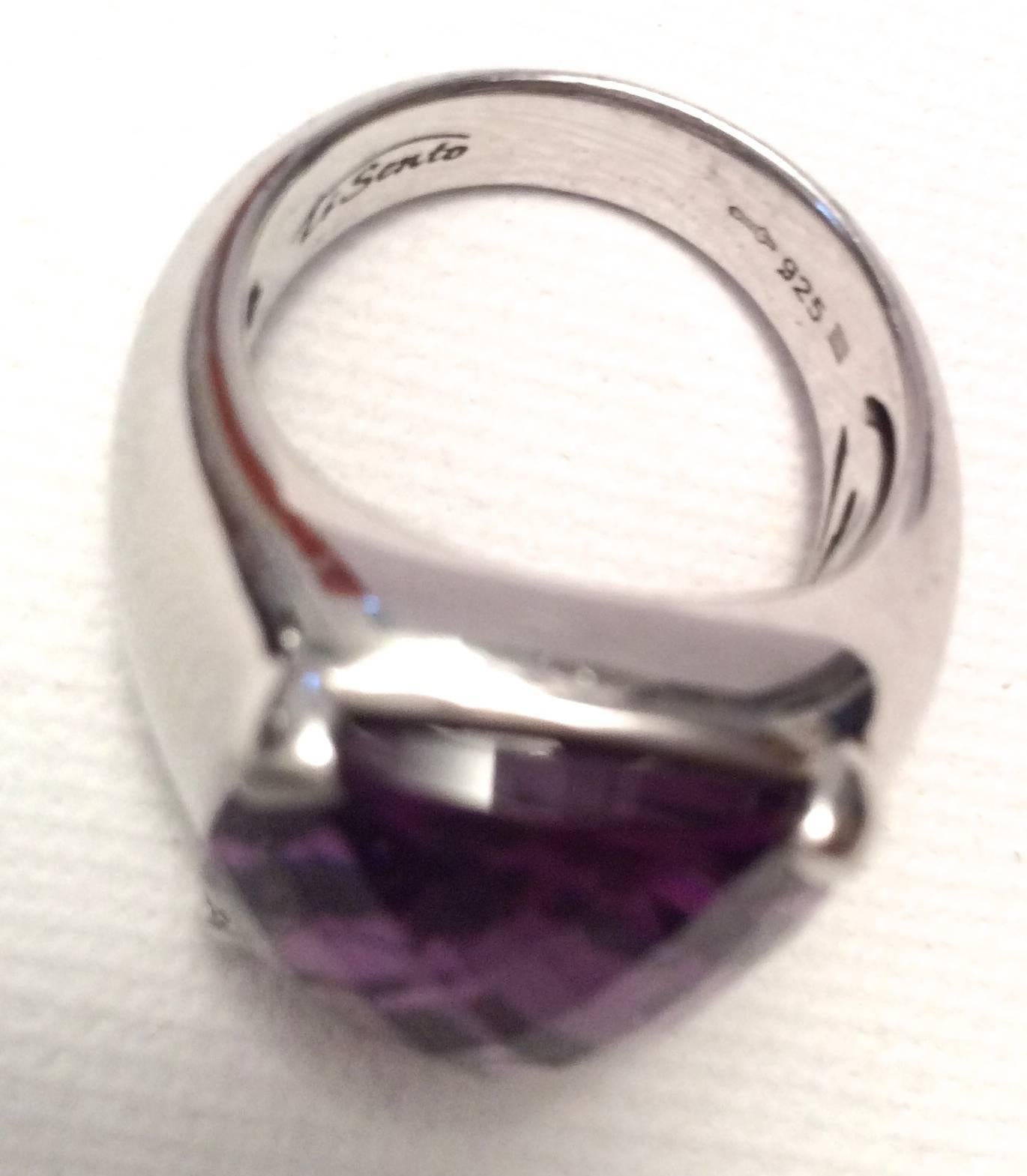 This beautiful 12 carat multi-faceted amethyst sterling silver ring is designed by Ti Sento from the 1980's. The stone is set in four prongs on a sterling silver mounting and the faceted amethyst shows off a beautiful color to the stone. The