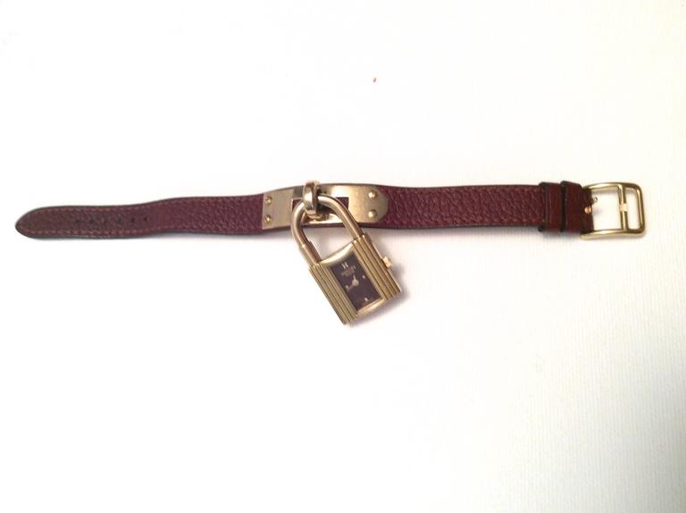Hermes Kelly Watch Gold Tone Burgundy with Matching Strap For