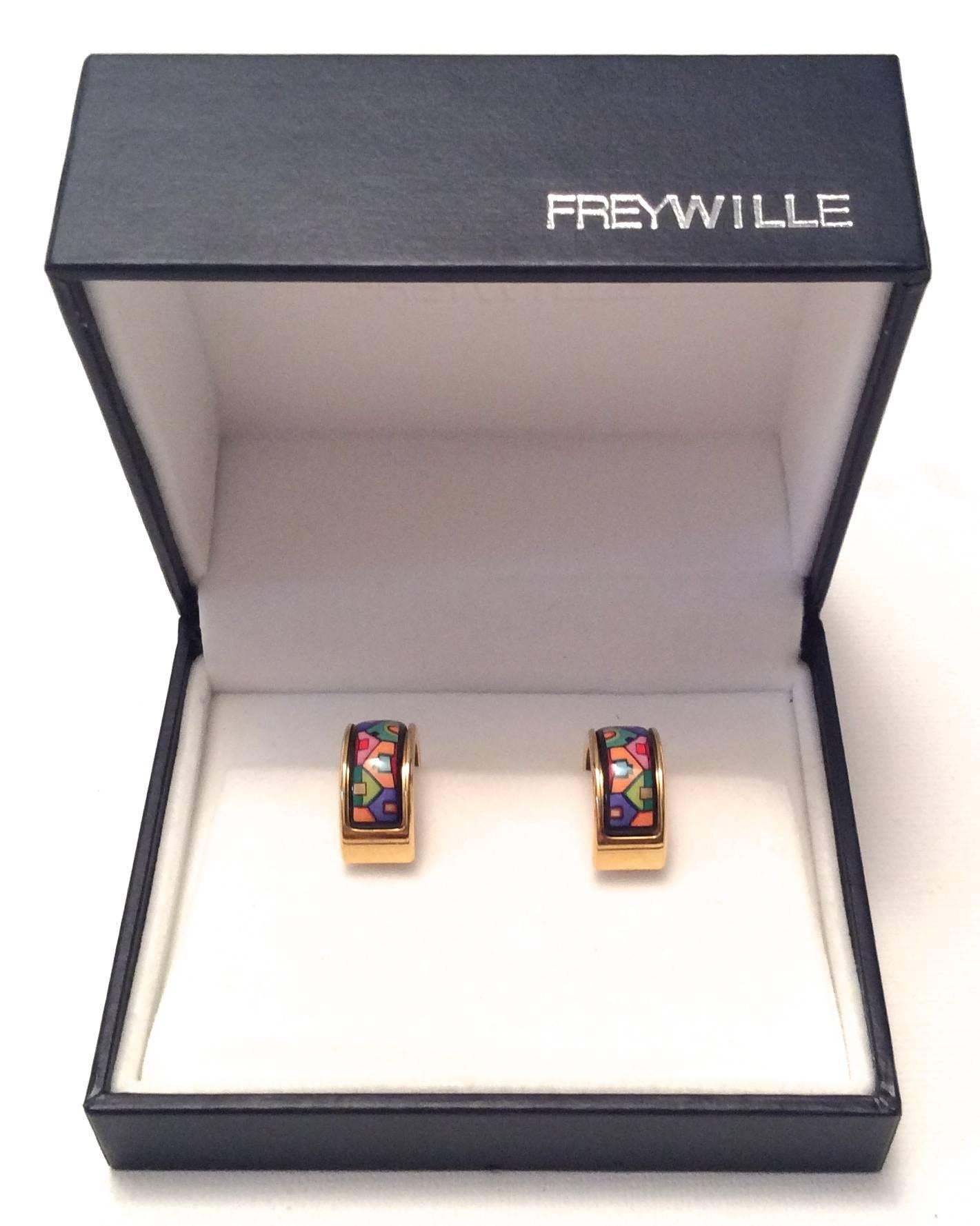 This beautiful Freywille set comprises a new pair of gold tone enamel pierced earrings in the beautiful variation after Hundertwasser / 905 Red River Streets Pattern. The gold tone piereced earrings measure 3/4 of an inch high and half an inch wide.