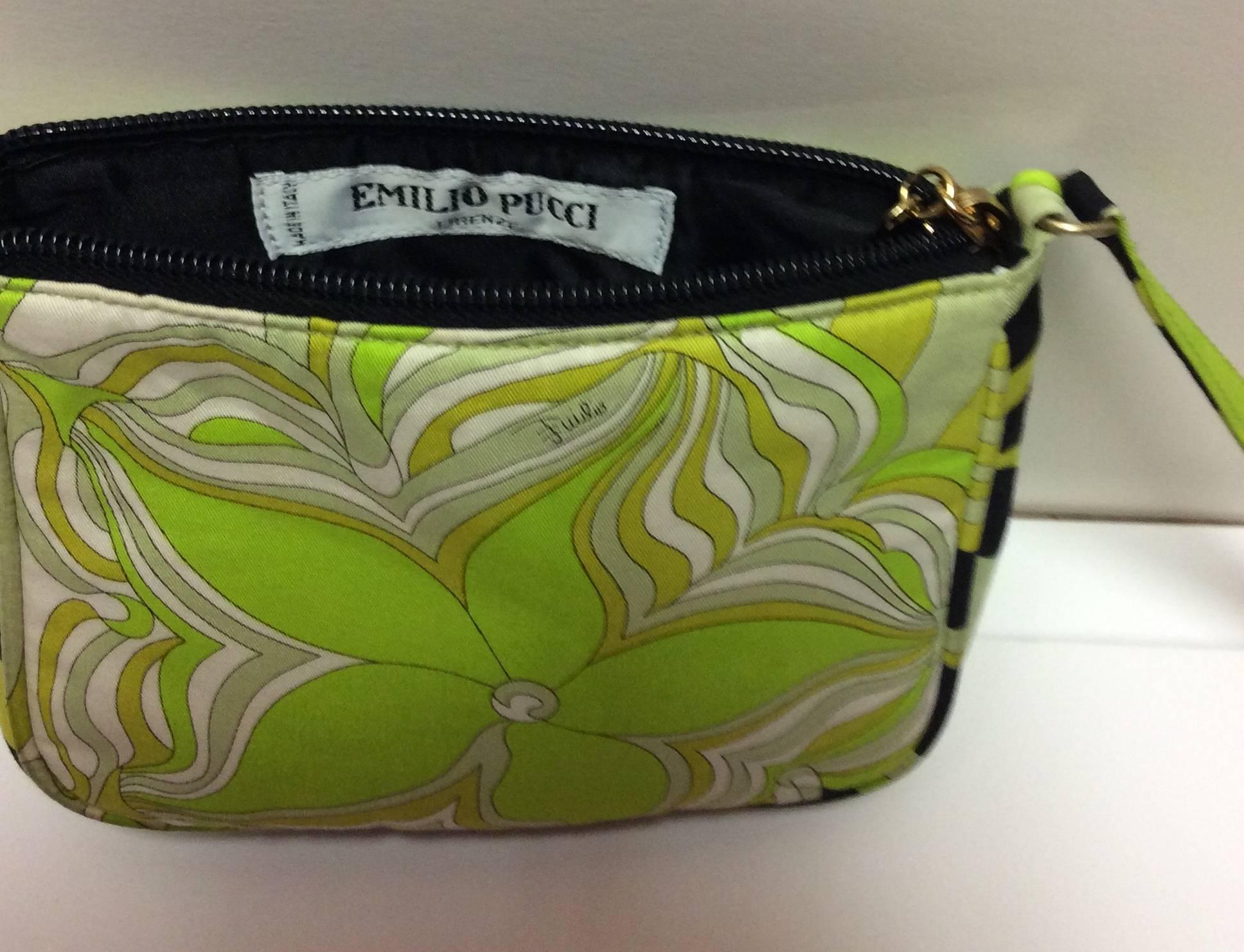 This is a darling little 100% silk Emilio Pucci mini handbag or can be used to connect to your purse as a little pochette. The pochette is 5.5 inches high, 7 inches long, and 1 inch wide at the top and 2 inch wide at the bottom. The beautiful