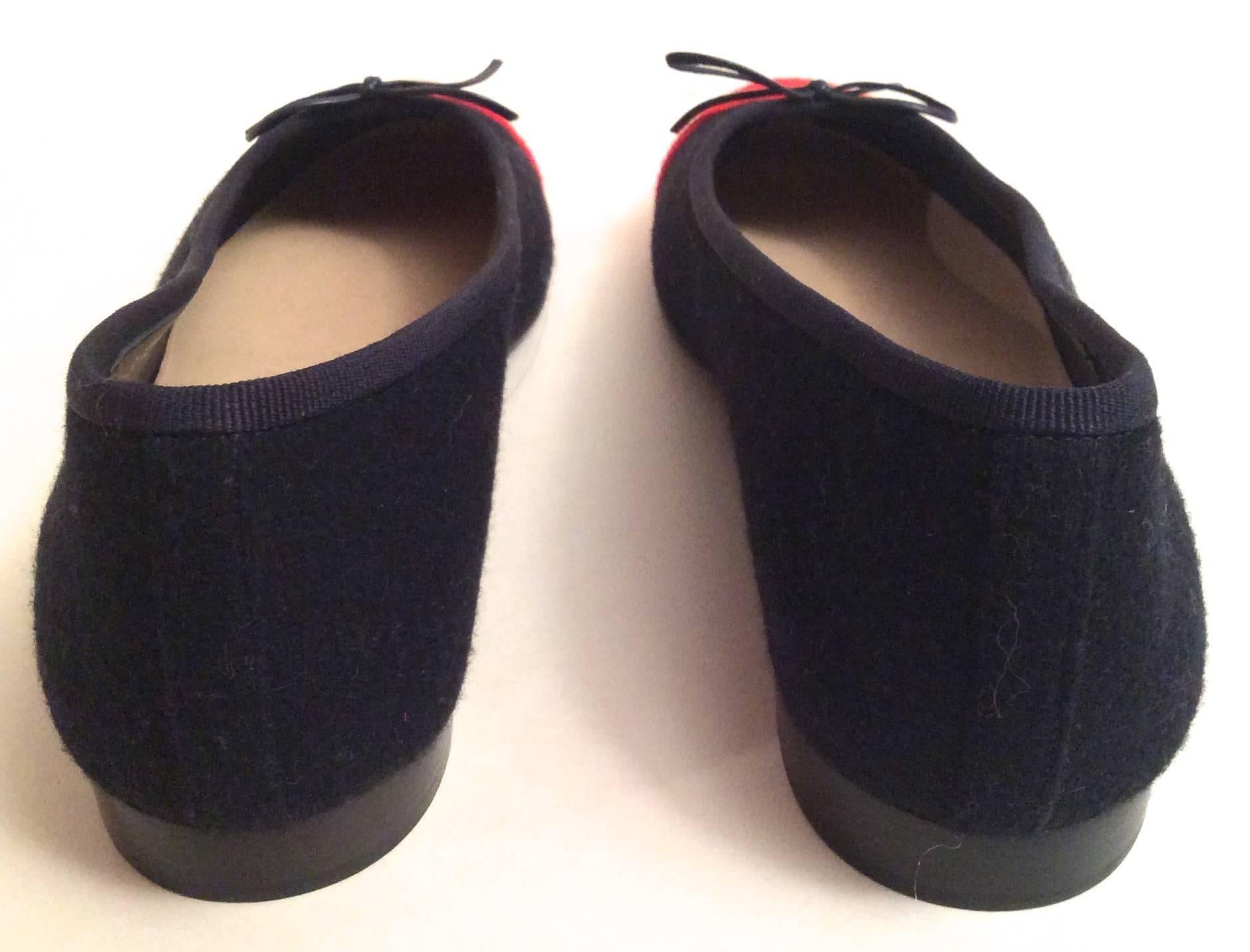 New Chanel  Ballerina flats with n blue and red boucle wool.  Gorgeous classic shoe that is versatile for all occasions. There is a CC logo sewn into the red toe region of the front of the shoe. Inside the shoe there is the Chanel logo stamped in