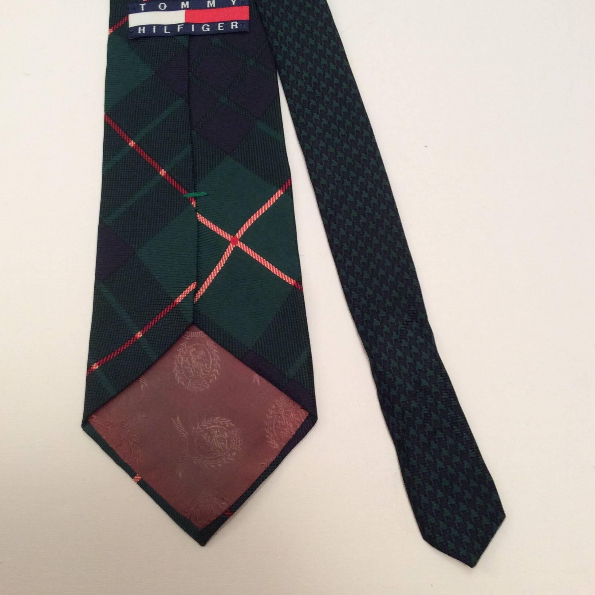 Tommy Hilfiger plaid silk necktie. The plaid is a green, blue, and red pattern. Gorgeous tie that is from the 1980's and in mint condition. A great addition to any personal clothing collection. 