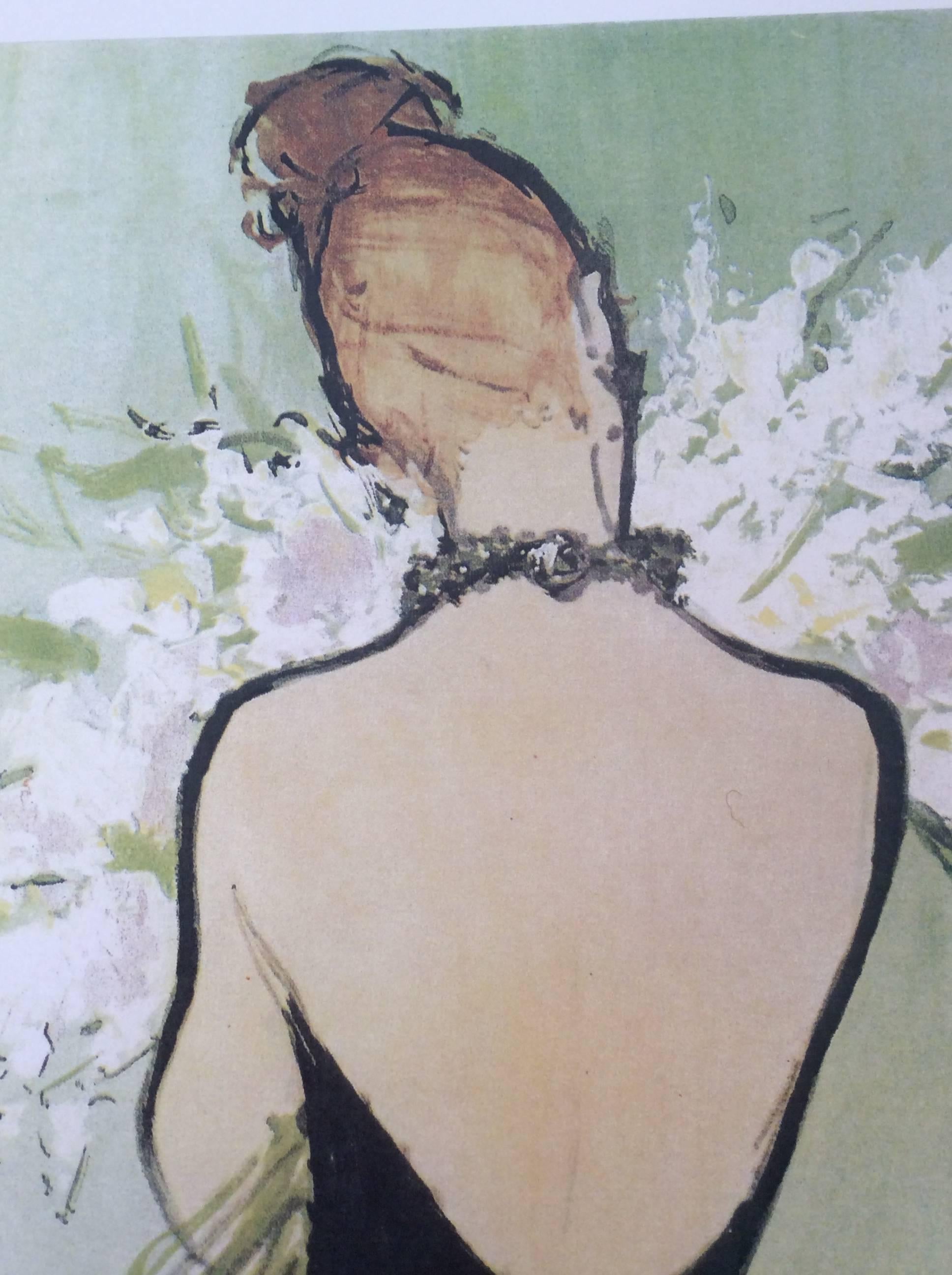 This rare Christian Dior ad print is a picture of a woman dressed in a black dress. She is showing her back to the viewer and appears to be holding something like a bouquet of flowers. A gorgeous picture set on a light green background. The ad is