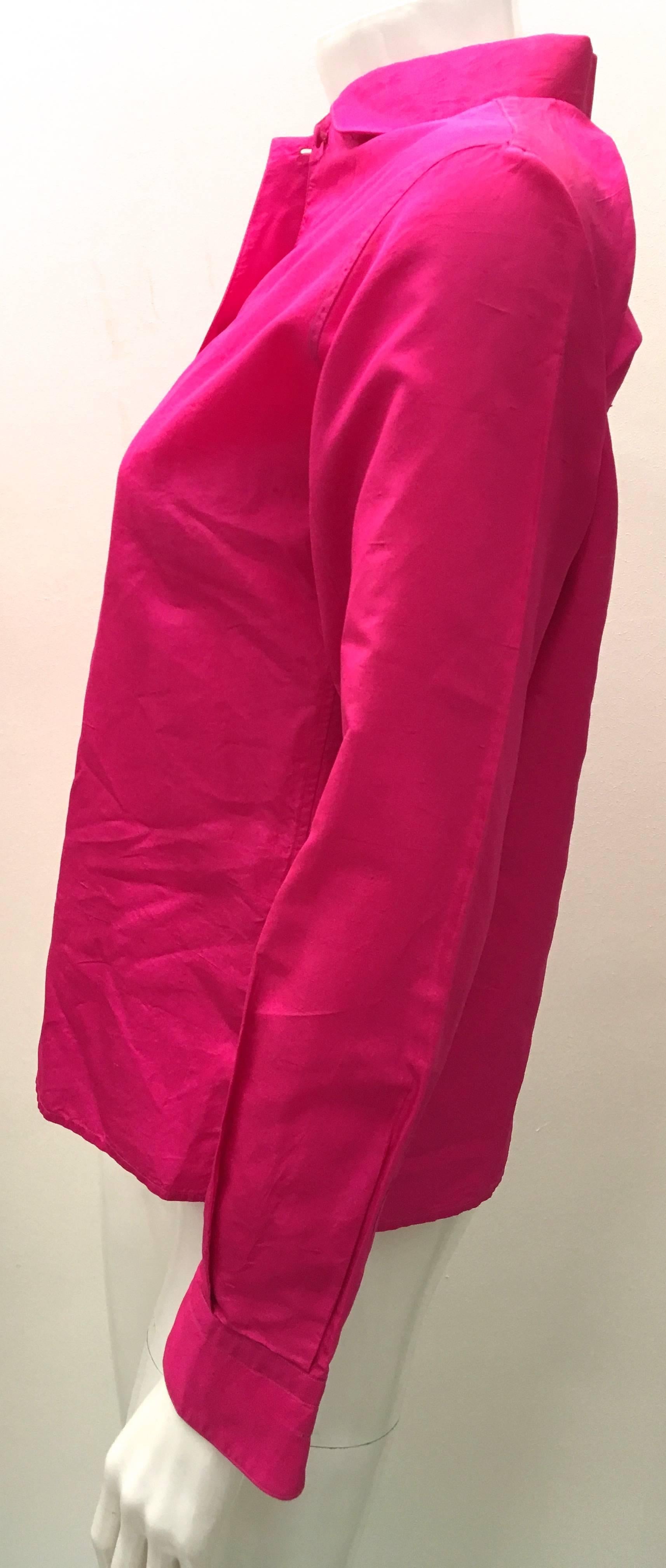 Presented here is a beautiful silk magenta blouse from Emilio Pucci. The blouse is from the 1960's and is a size 8 from that era. Fits like a size 2. The blouse is a solid silk magenta throughout the blouse and has buttons covered in magenta fabric