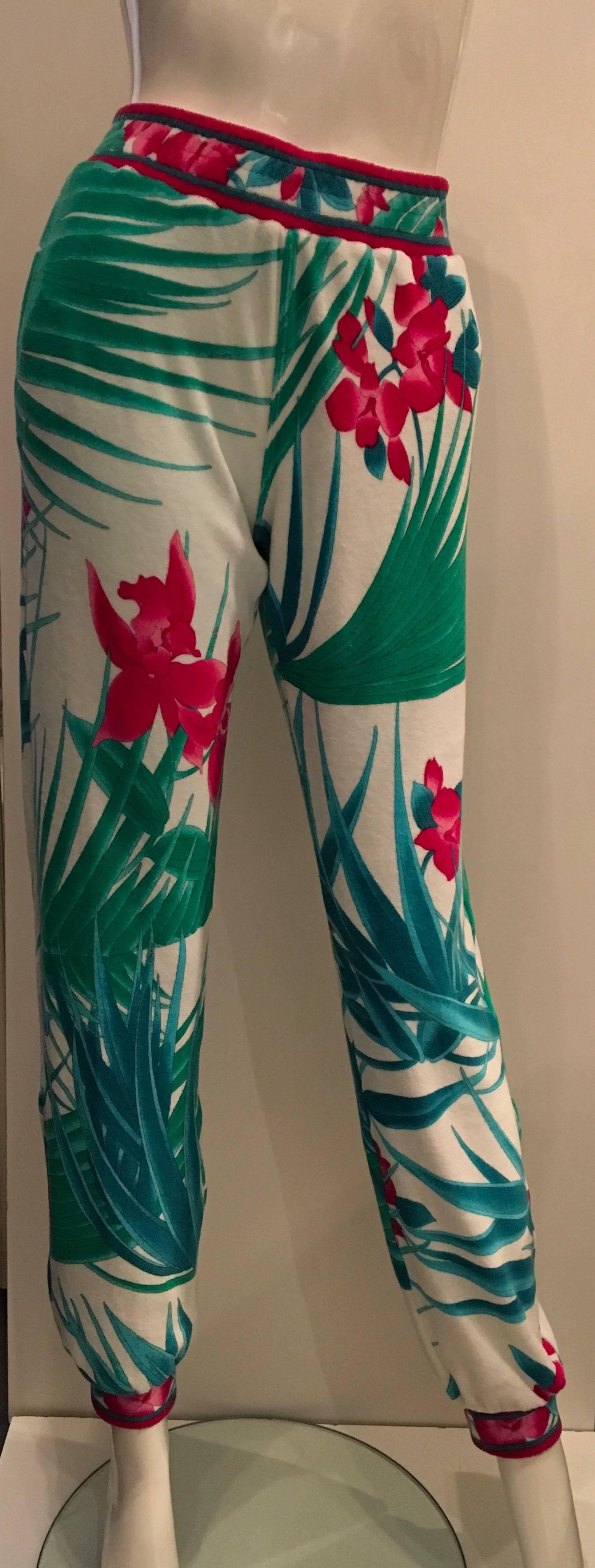 This beautiful pair of never worn Leonard terry cloth pants are a rare item indeed. Leonard of Paris does not do a large amount of their line in terry cloth. This beautiful floral pair of pants have a white background with a pattern of leaves and