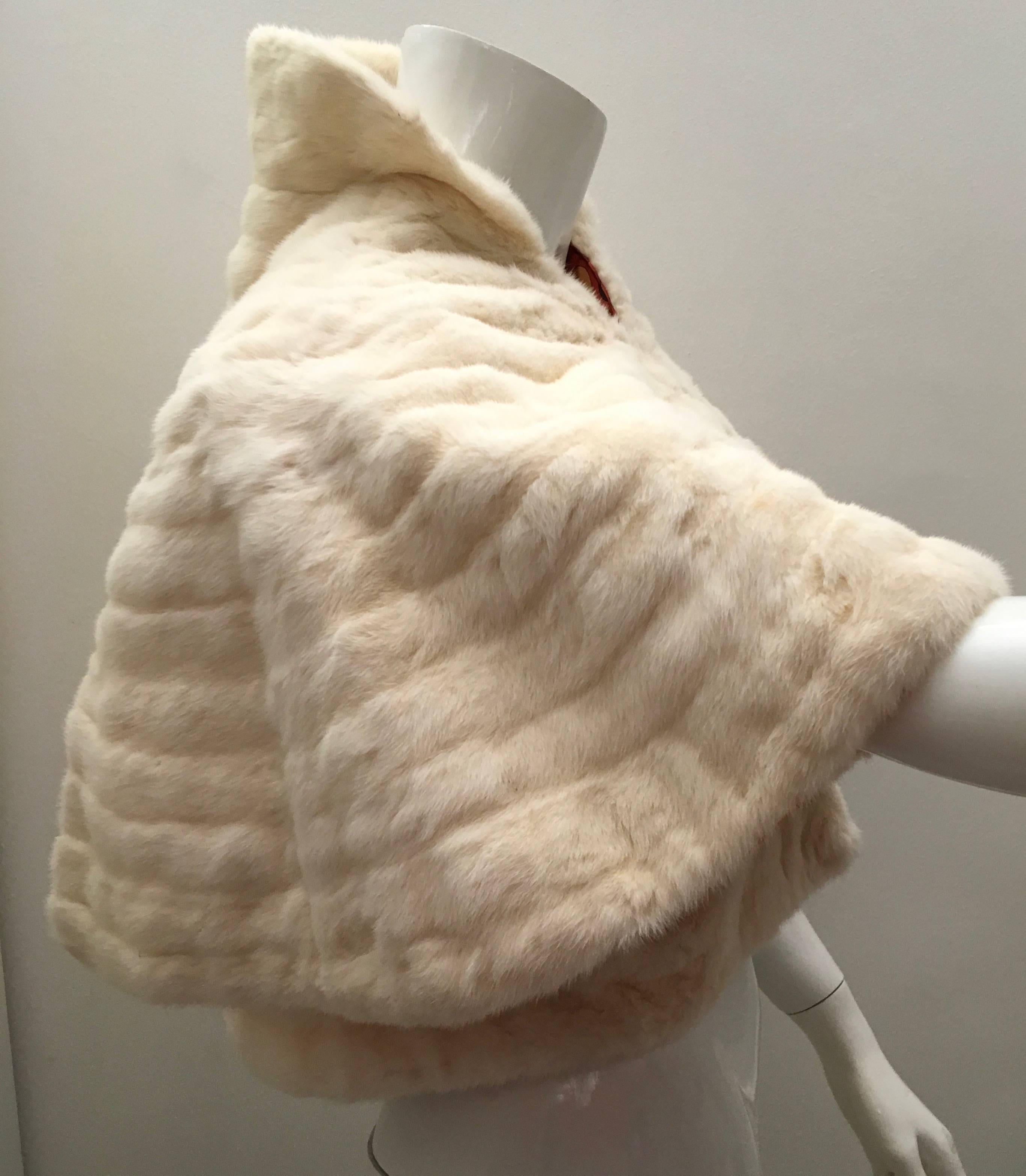 Presented here is a rare mint condition white ermine fur swing jacket from the 1950's. This magnificent short swing jacket is unlike anything you've ever seen. The label is the fabulous P. Baril furrier company of Nice, Paris and Monaco since 1900