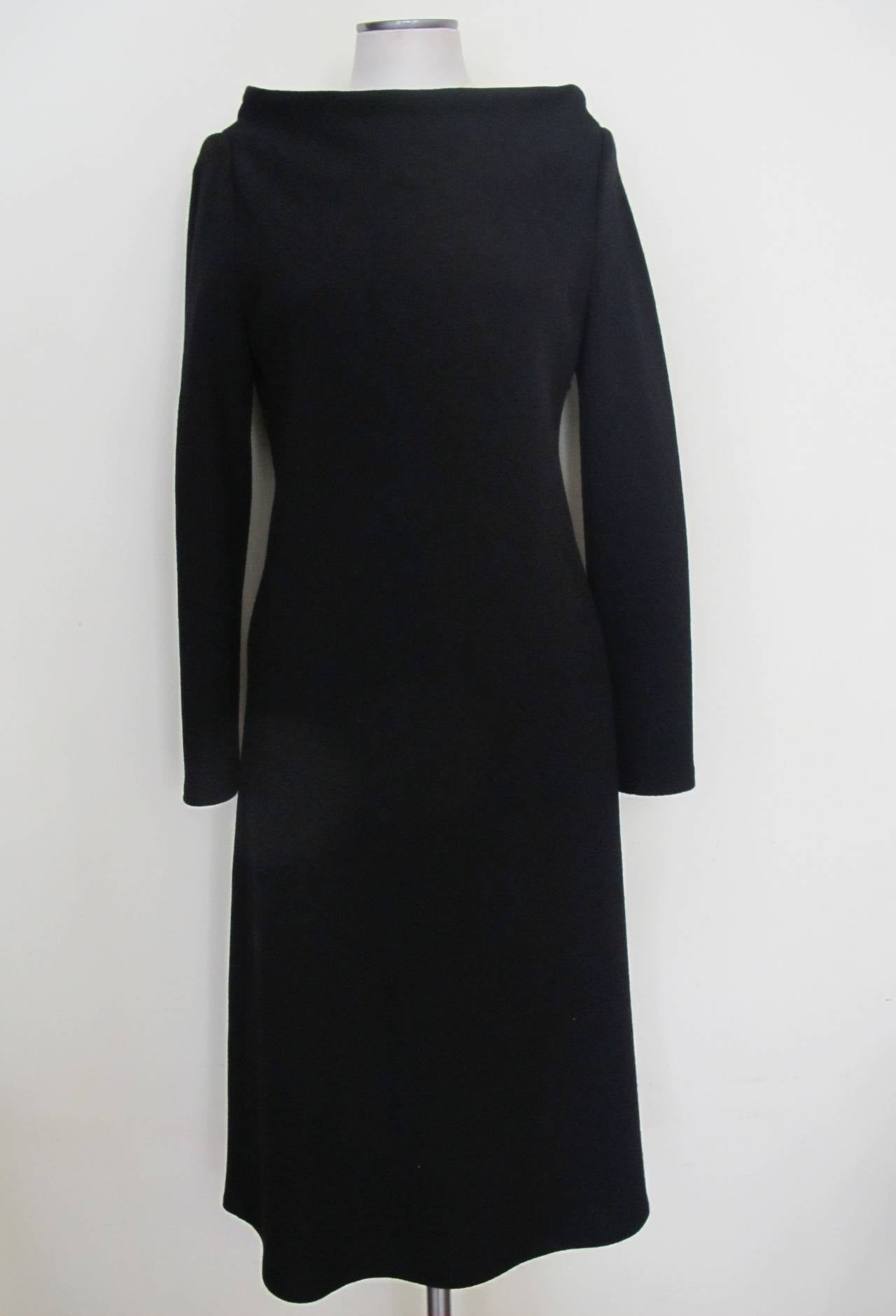The neckline of this day or cocktail dress is exquisite and is a variation of the bateau (boat style) neckline. This A-Line silhouette fits divinely on the body. Barbara Schwarzer designed for Bergdorf Goodman for a few years. Sleeve length measures