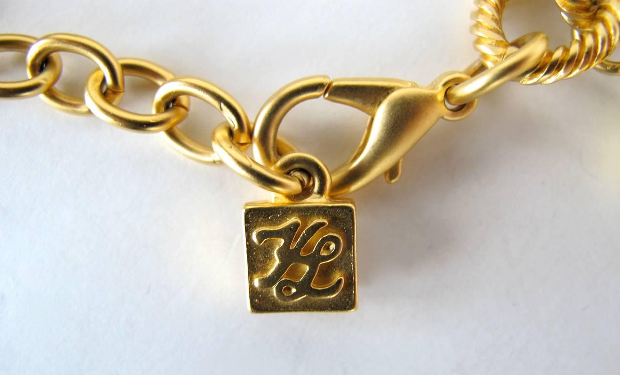 1980's Karl Lagerfeld Gold-Tone and Pearl Paris Inspired Charm Bracelet For Sale 1