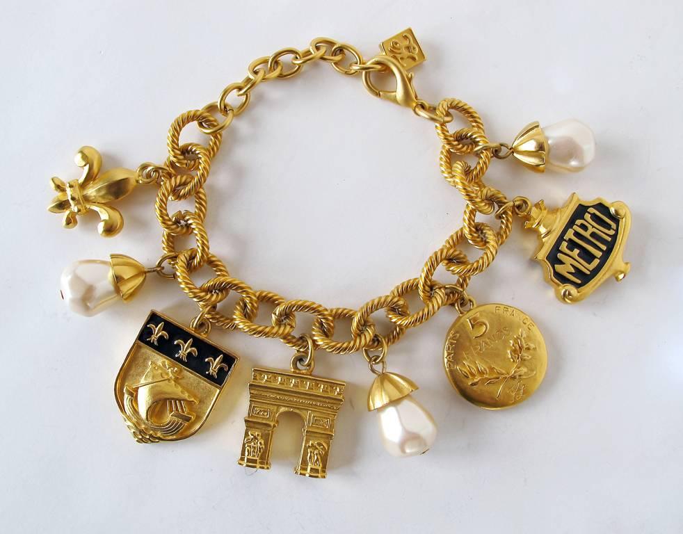1980's Karl Lagerfeld Gold-Tone and Pearl Paris Inspired Charm Bracelet For Sale