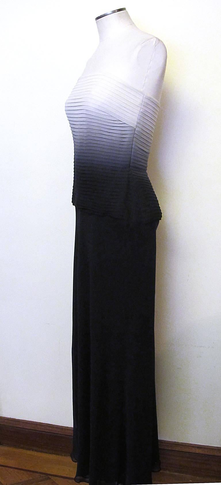 This fabulous Melinda Eng strapless evening gown has a pleated bodice and bias cut skirt. The ombre effect fades from white to black in beautiful 100% 
silk chiffon. The dress is in excellent condition and tag is still attached.

*Your Purchase