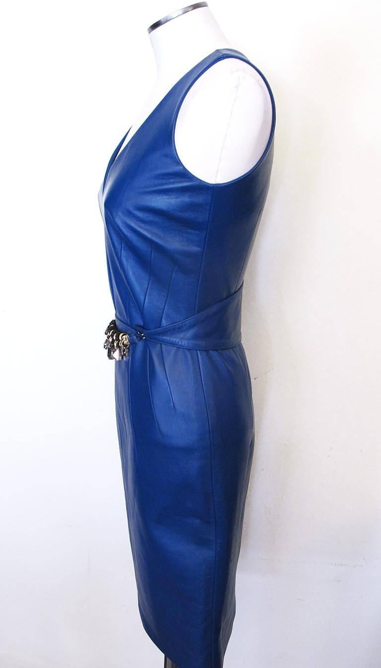 This Versace spring/summer 2013 cobalt blue leather v-neck dress has decorative angular darts at the waist. There is a matching cobalt leather belt with jeweled charms (one is a Versace Medusa head). The piece is new with tags attached.

YOUR