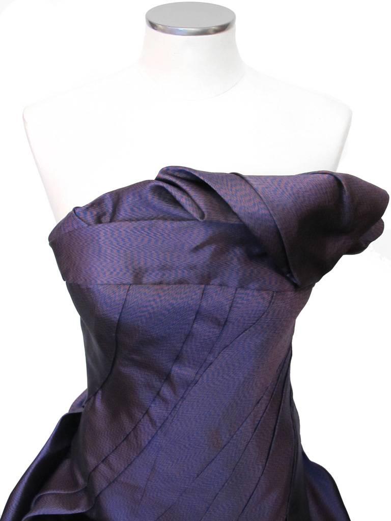 This Fabulous Rubin Singer strapless ball gown is in a horizontal chevron print of purple, emerald green and navy blue silk-satin organza and lined in purple silk. The bodice is angled and the whole gown is draped in a 