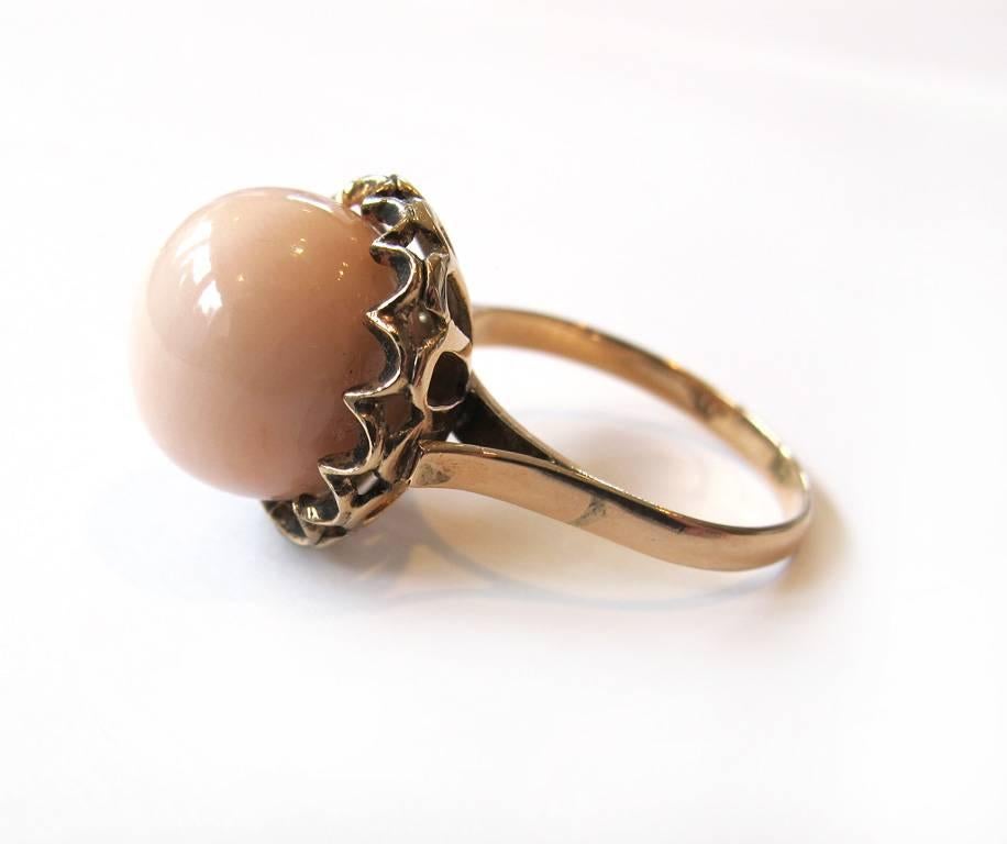 This elegant 1950's pale coral 14 karat gold ring was donated by a jeweler who kept it in his archives in San Francisco. The piece has never been worn.

Ring size: 6

YOUR PURCHASE BENEFITS THOSE WHO ARE DEVELOPMENTALLY DISABLED.