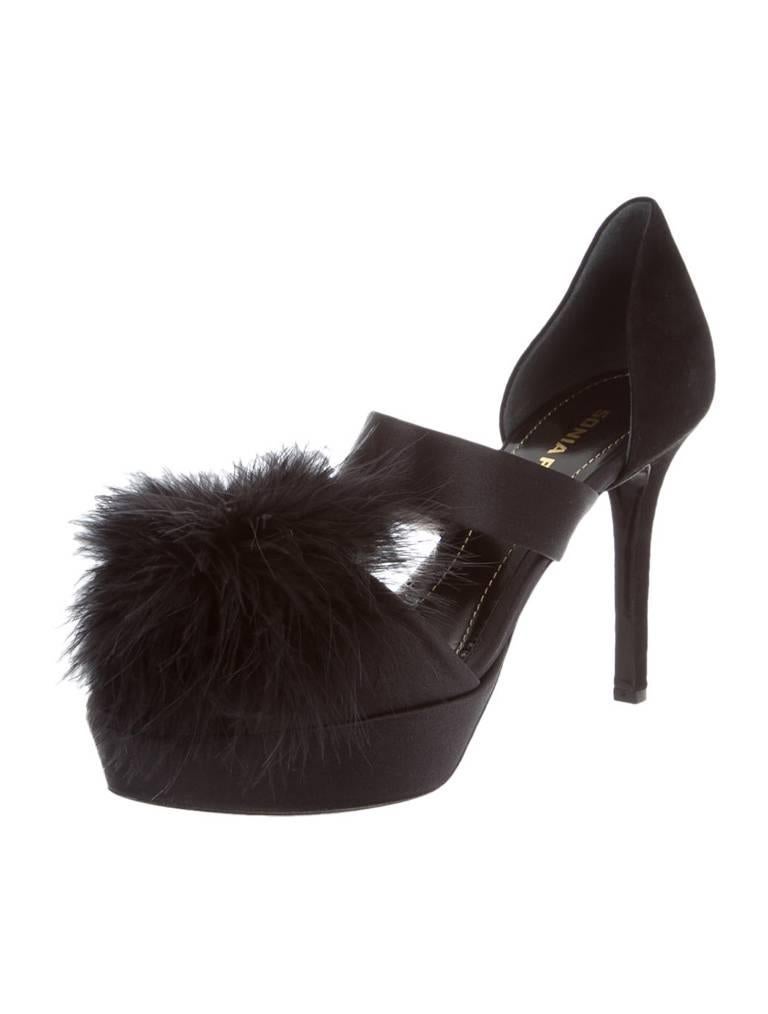 Black satin Sonia Rykiel peep-toe pumps with feather accent at top of shoe and 4" covered heels.

Your Purchase benefits Helpers, a non-profit organization, which helps those who are developmentally disabled. 