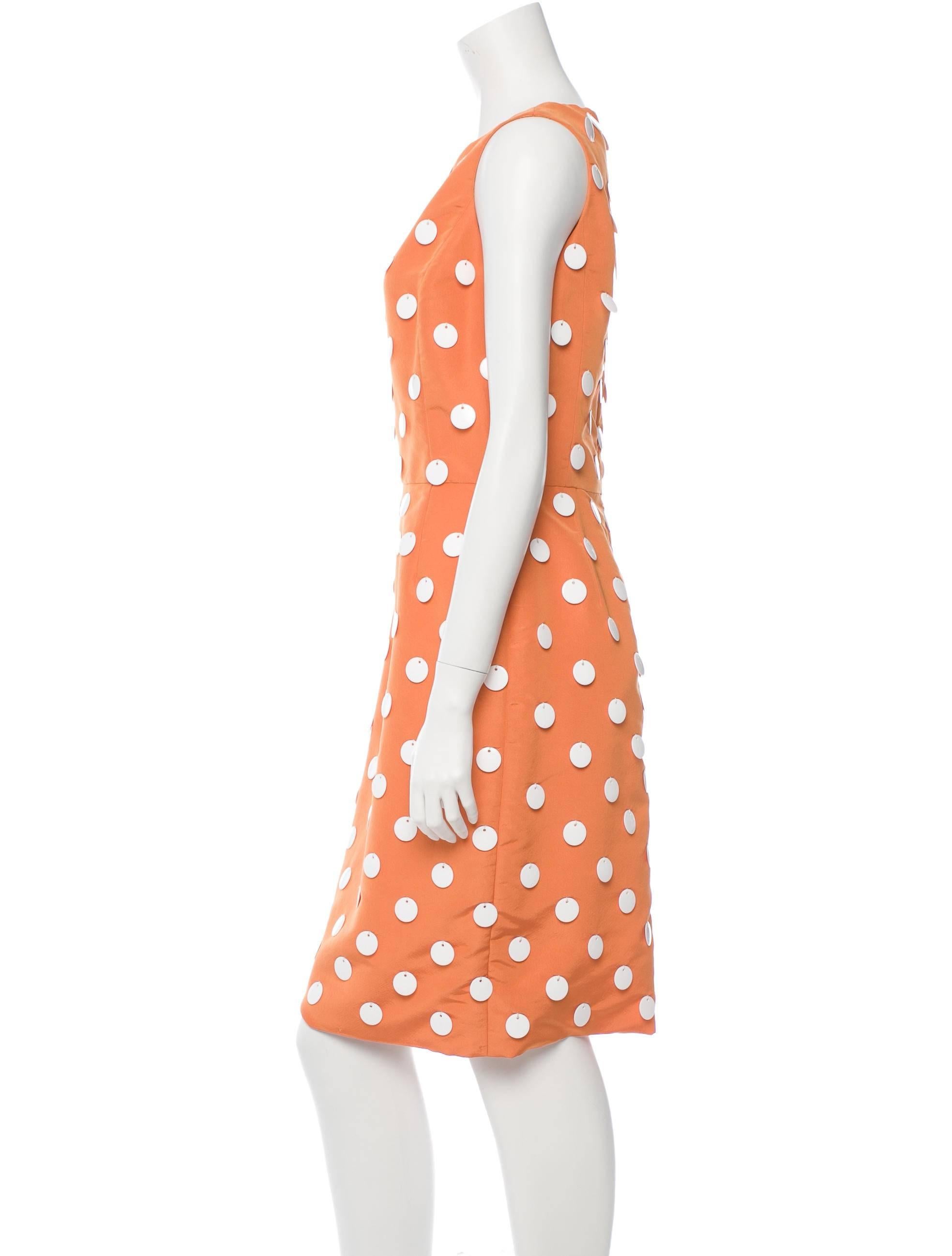 From the Resort 2008 Collection. Orange silk taffeta Oscar de la Renta sleeveless dress with white paillette embellishments throughout, bateau neck and concealed back zip closure.

YOUR PURCHASE BENEFITS THOSE WHO ARE DEVELOPMENTALLY DISABLED.
