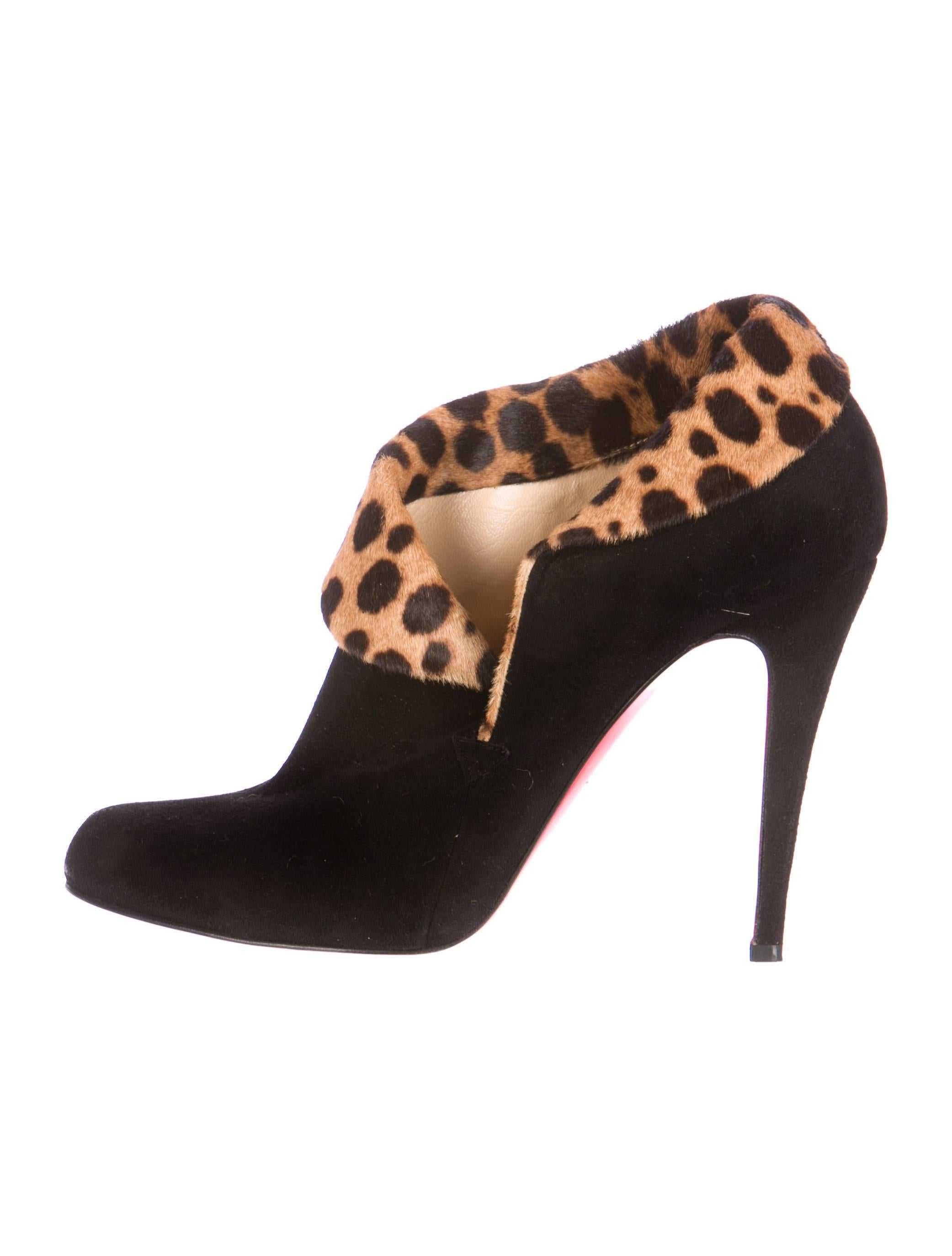 Black Christian Louboutin suede pointed-toe booties with leopard print calf hair trim and covered heels.

YOUR PURCHASE BENEFITS THOSE WHO ARE DEVELOPMENTALLY DISABLED.
