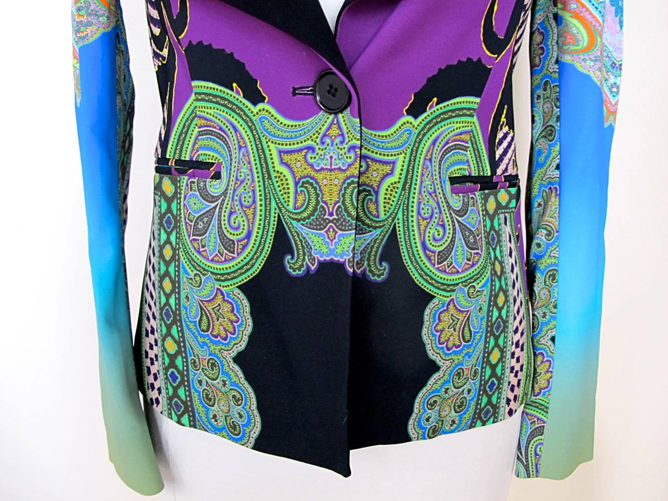 Colorful and bold black and multicolor Etro long sleeve blazer with paisley print throughout and blue and green gradient on bottom half of sleeves. Button closures at center front. 

Fabric: 86% Viscose, 10% Acetate, 6% Elastane

Measurements: Bust: