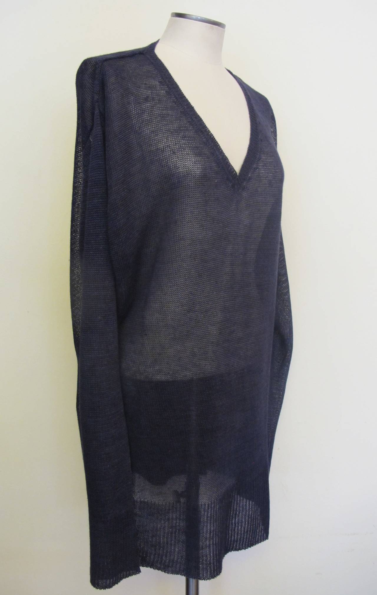 Fabulous, straight navy blue sweater. The fabric is impressive: 100% Linen knit. The V-Neck adds to the casual feeling of the garment and its comfort. Shoulder to shoulder measures 18.75 inches. Sleeve length measures 28 inches long.