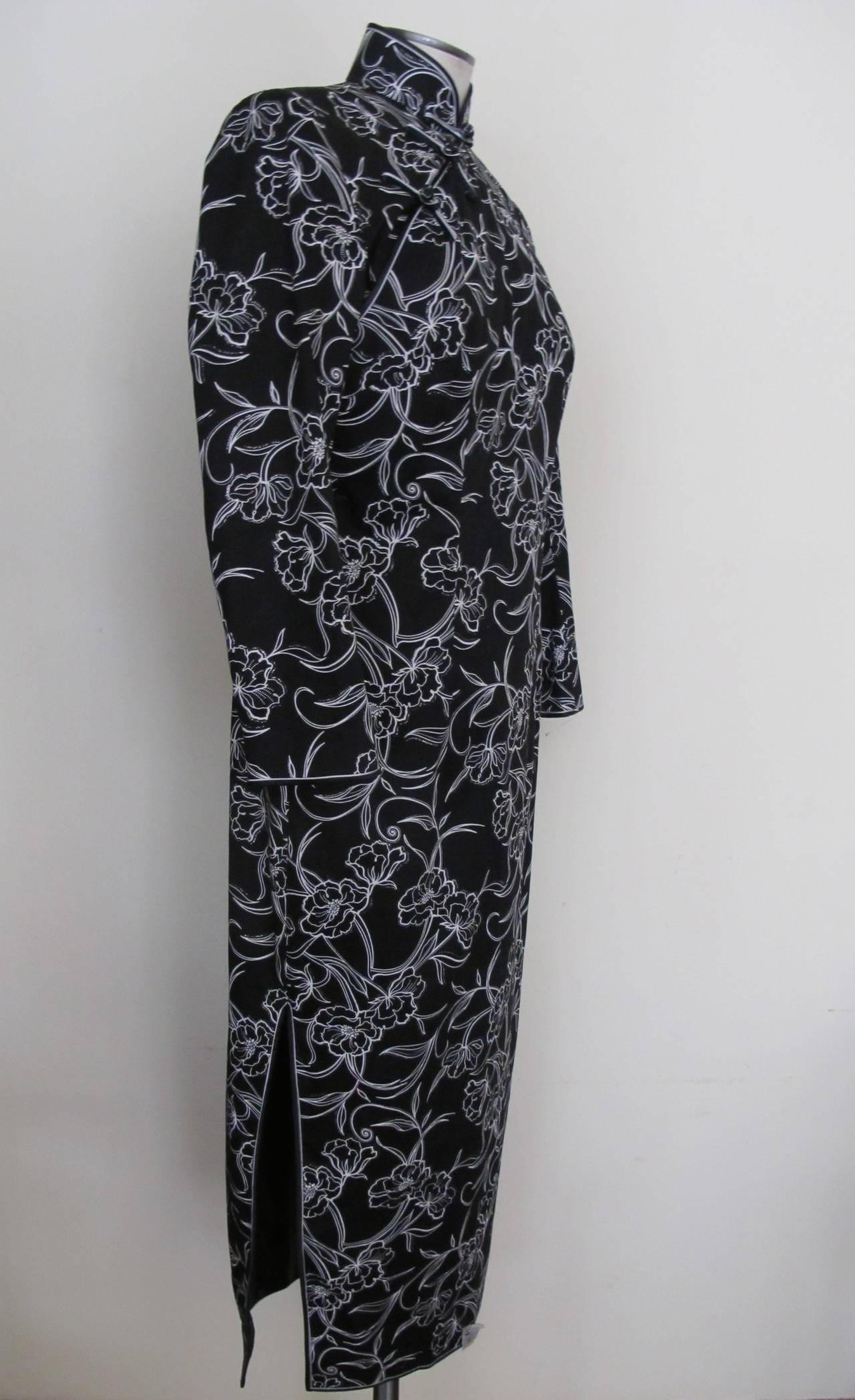 This new 1970's Qipao Black Silk Cotton Dress was commissioned by the Fashion Director of Saks Fifth Avenue. The original tag is sewn on the front of the dress. It was given to Helpers House of Couture to help those who are developmentally disabled.