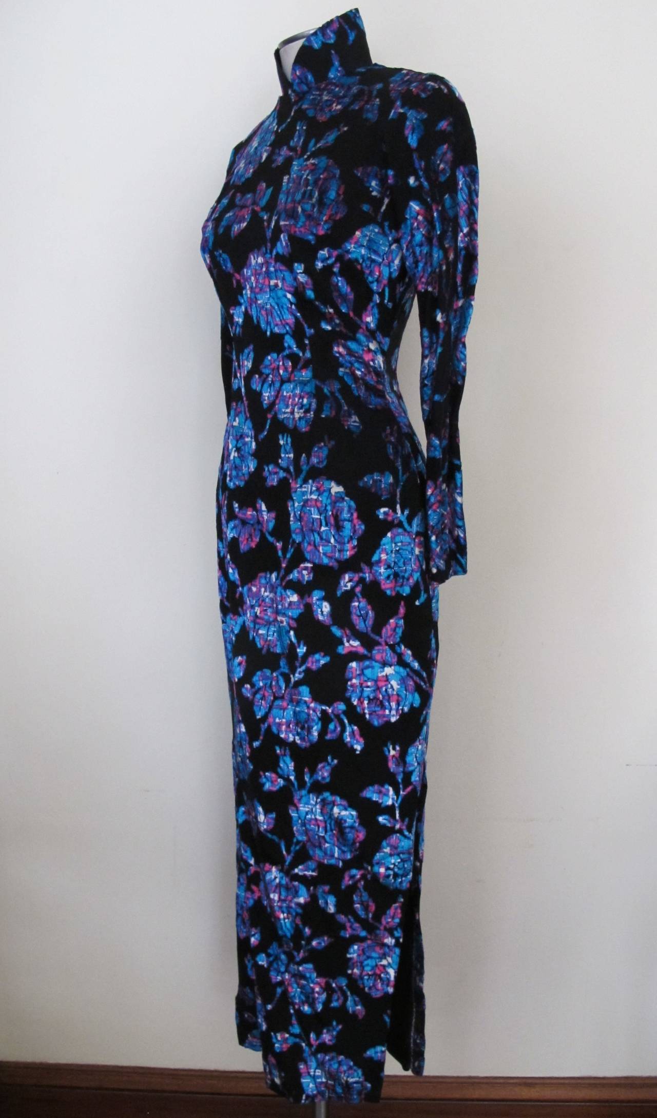 Asian Mandarin Collar Black Dress with vibrant flowers: neon blue and neon pink. It is exquisite when on the human form. It is lined in silk and hand-tailored. Sleeve length measures 22.5 inches. Shoulder to shoulder measures 14 inches.