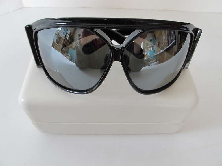 Balenciaga Over-Sized Black Sunglasses with logo on side. These glasses were originally purchased in Paris. They are chic, fabulous and over-the-top. The design is unisex; comes in original case and Balenciaga spectacle cleaning cloth. The glasses