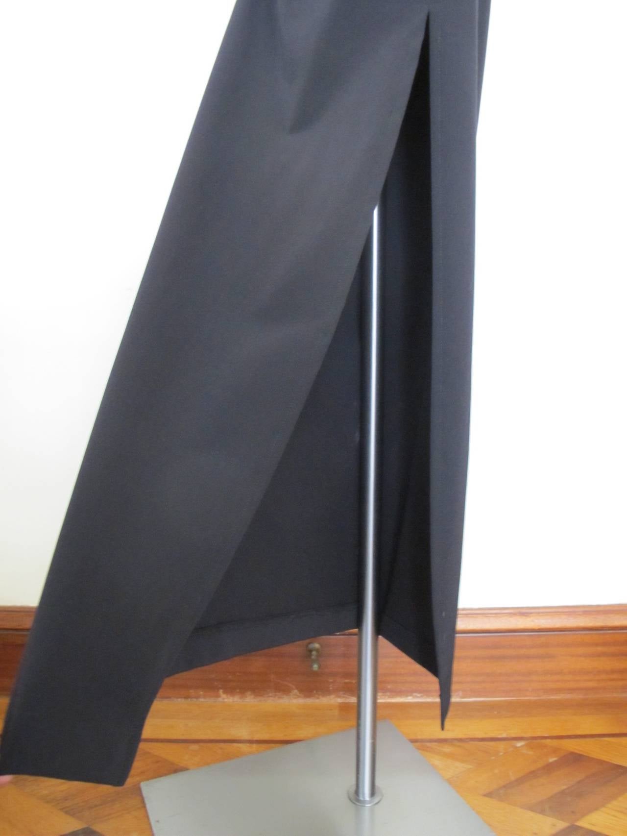 This elegant long skirt has a slit on the left of 27.25 inches. There is 8.5 inch band of fabric that serves as a corset on the waist and part of hip.