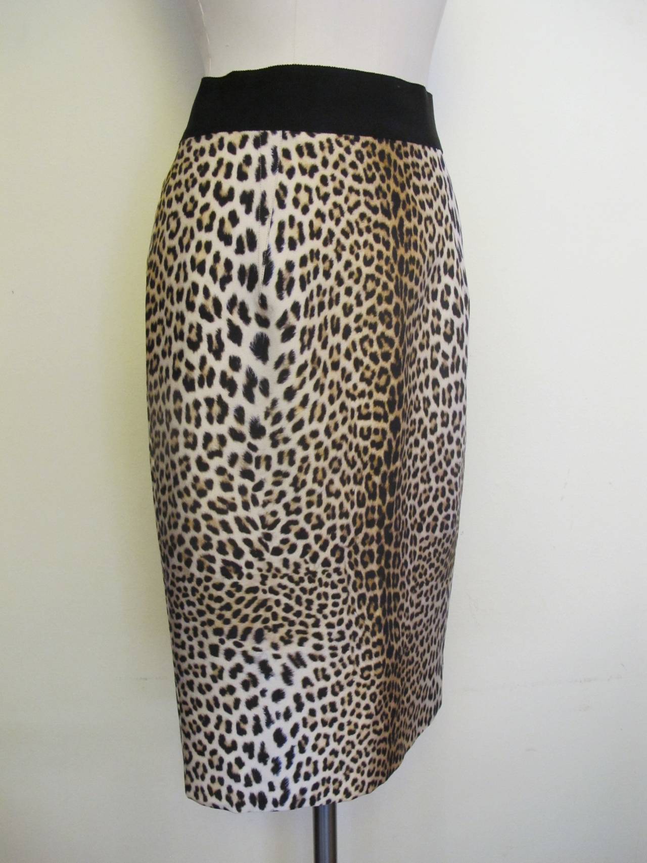 The leopard design printed on the silk fabric is exquisite. Two inch gros-grain ribbon forms the waistband. The pencil skirt is exquisitely tailored and has side zip closure. It may be worn for day or cocktail wear.