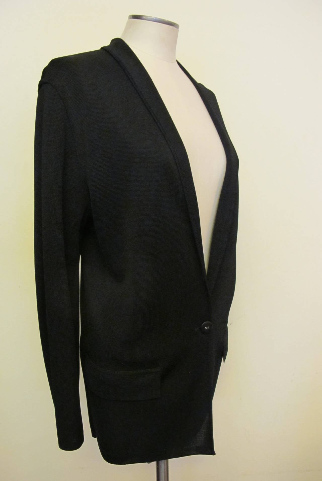 Comfortable, Chic Black Alaia Jacket from the 1980's. It fits perfectly with drop shoulder and hugs the body. Words cannot describe the beauty of this simple jacket. Sleeve length measures 22.5 inches. Shoulder to shoulder measures 17 inches.