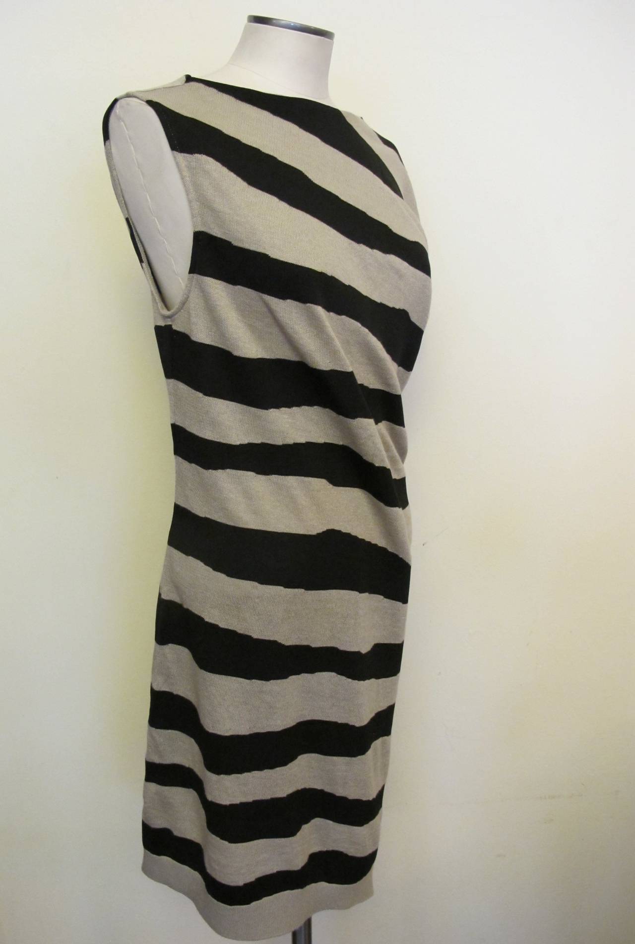Balenciaga Zebra striped angular dress is new with Barney's tag. It has three snap buttons on the bottom left side of the garment.