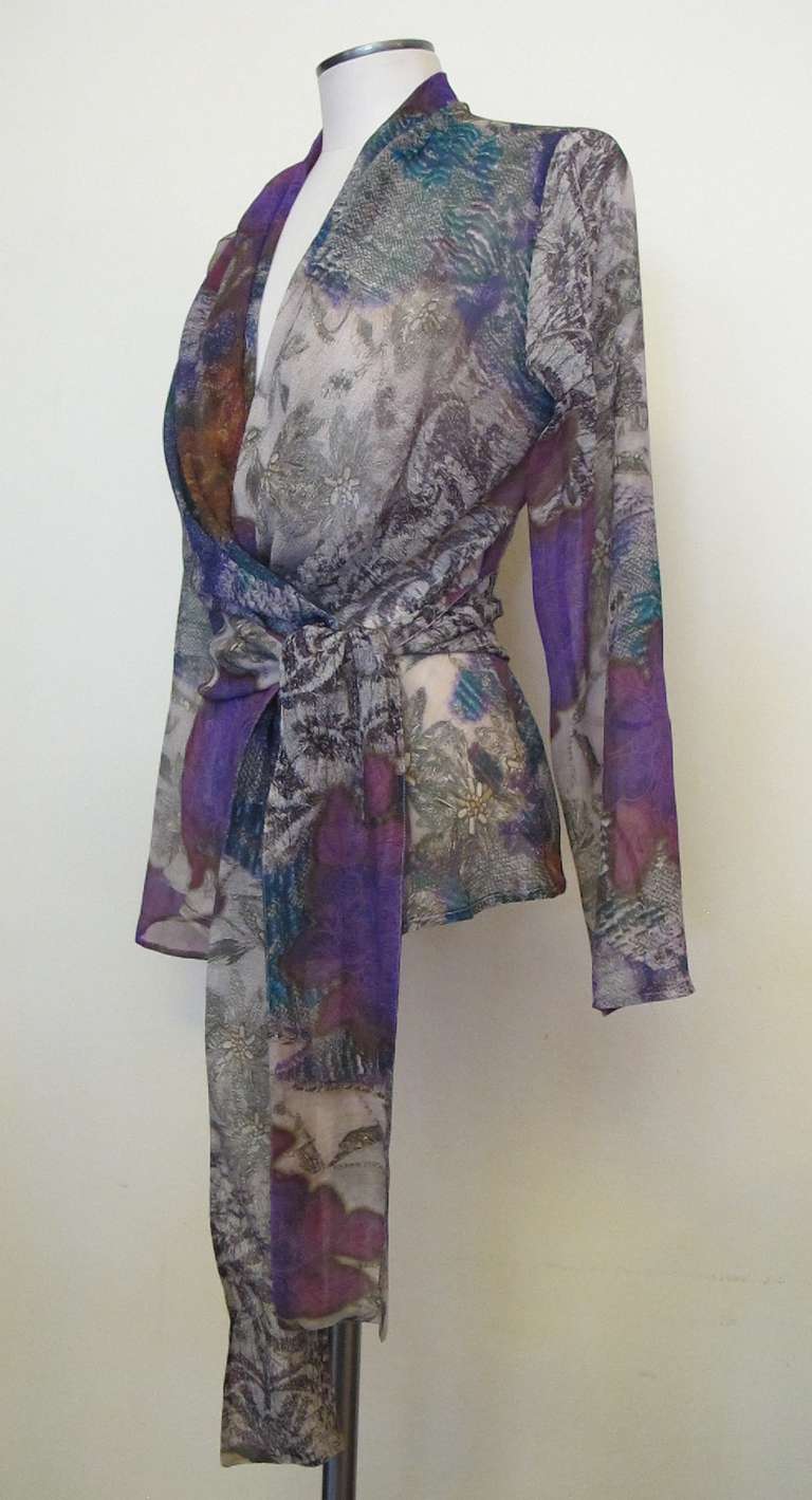 Gorgeous Etro blouse in silk chiffon and muted colors: fuchsia, lavender, turquoise, blue. Words can not explain this dream captured in the fabric and style. Attached sash by two buttons in back. It is truly a painting captured in fabric. Bust size