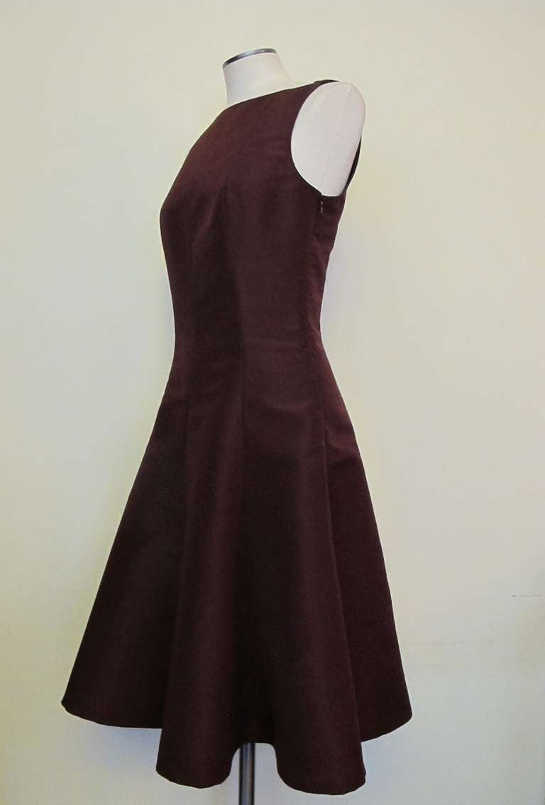 Elegant bateau neckline cocktail dress in the spirit of Audrey Hepburn. Ralph Lauren Purple Label collection new without tags. It is lined in Maroon silk taffeta.