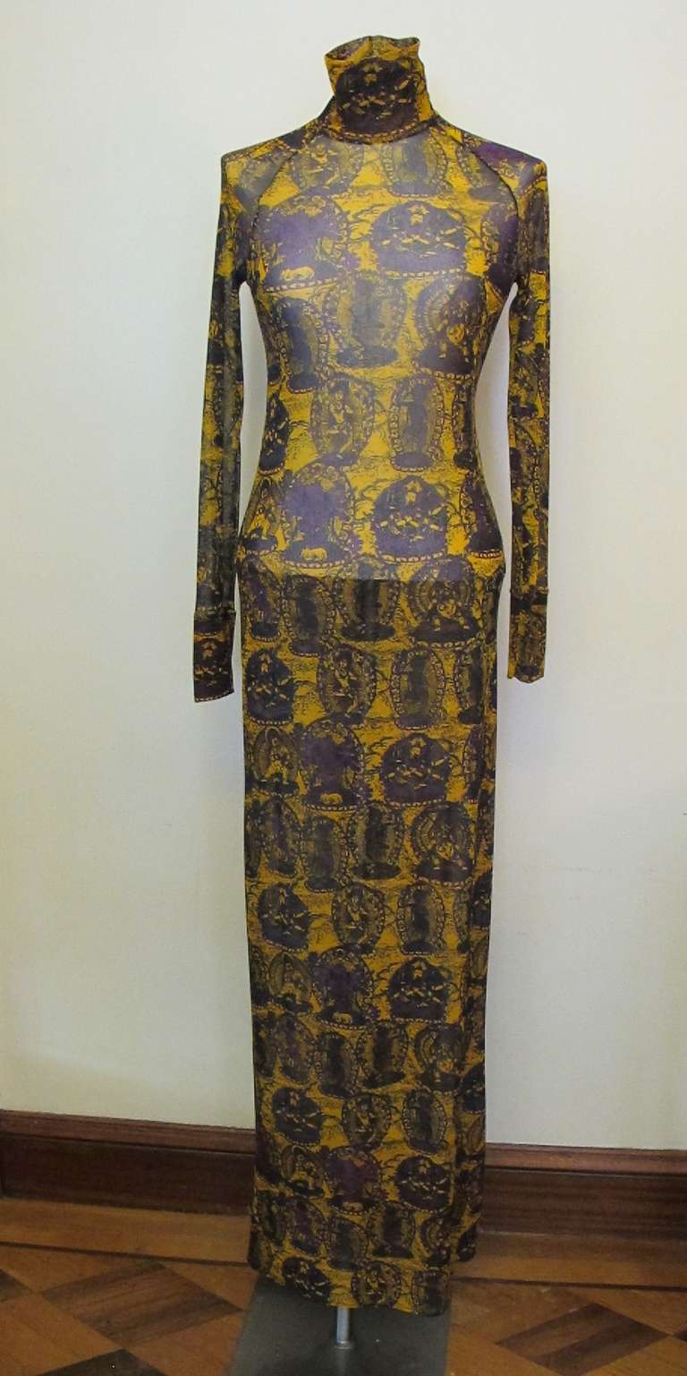 Stunning, collectable Vivienne Tam dress with stretch fabric and a 3.5 inch high collar. The high neck is exquisite. Golden mustard hue with purple. Raglin sleeves measure 29.5 inches long. Dress says size 0 however fits sizes 2 to 6 due to stretch