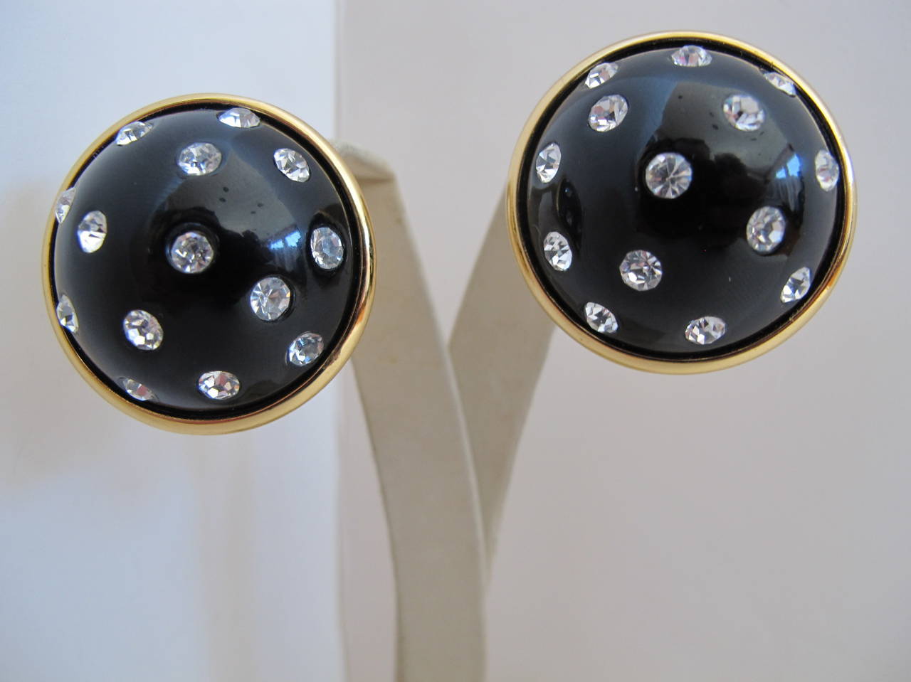 Black enamel earrings with rhinestones and gold backing were donated to us in original box by a San Francisco Grande Dame.