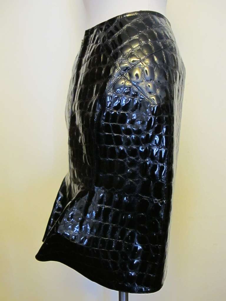 Rare black patent leather goatskin skirt with alligator embossed design. There is a 7 inch Alaia famous bias flair at the bottom of the skirt.