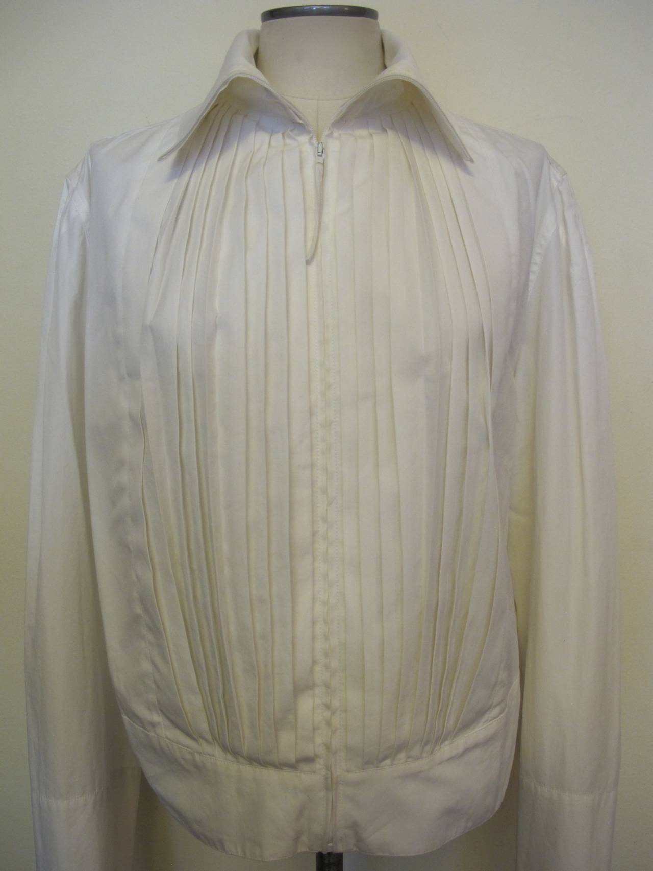 Jean Paul Gaultier Homme White Cotton Jacket with pleated front and white  zipper and turtle neck collar. Sleeve length measures 31 inches. Shoulder to shoulder measures 16 inches. Neck is 16 inches. Size is large to extra large.