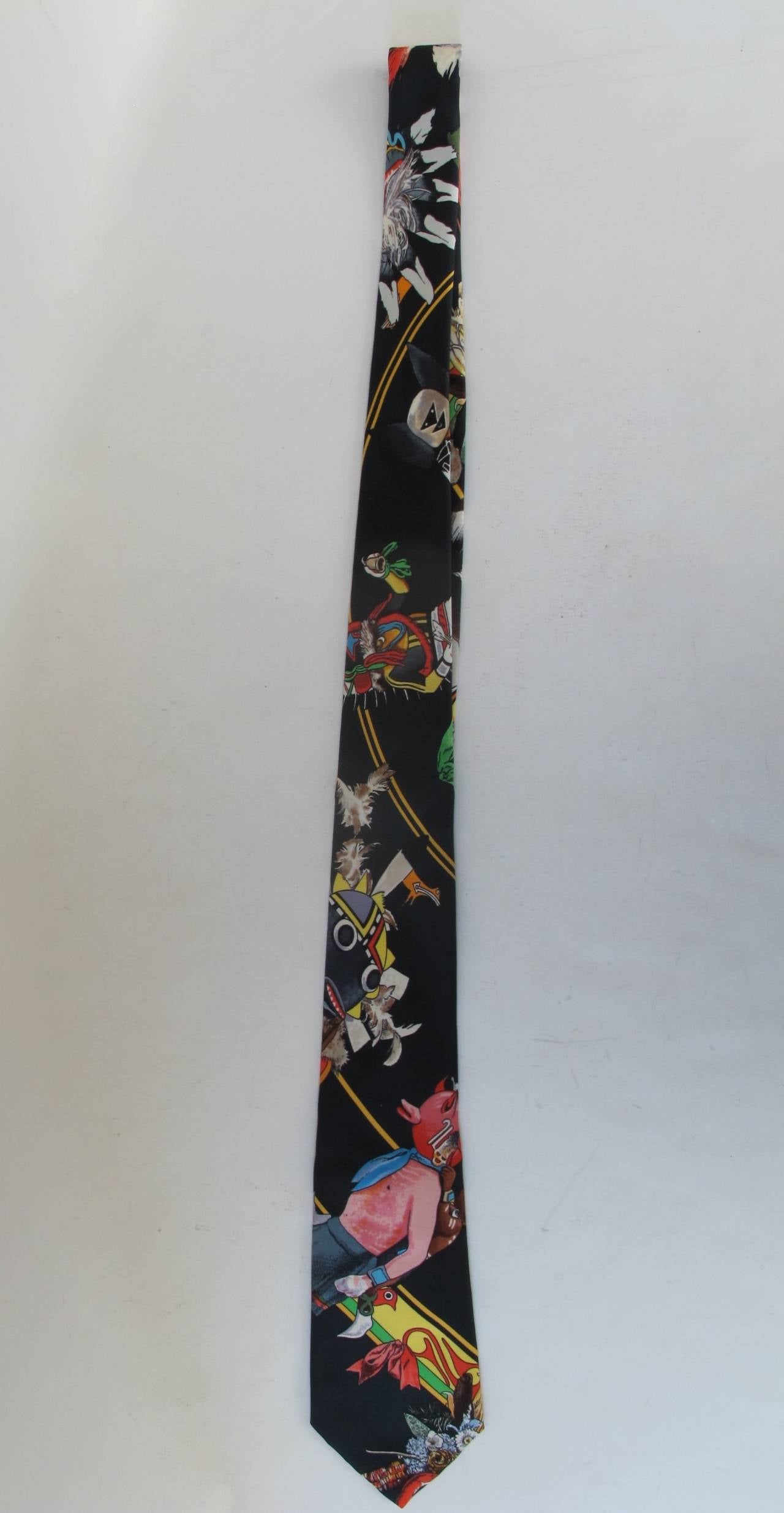 Rare Hermes Southwest Native American Kachina Dolls Theme Tie with black background. The tie is sought after by collectors.