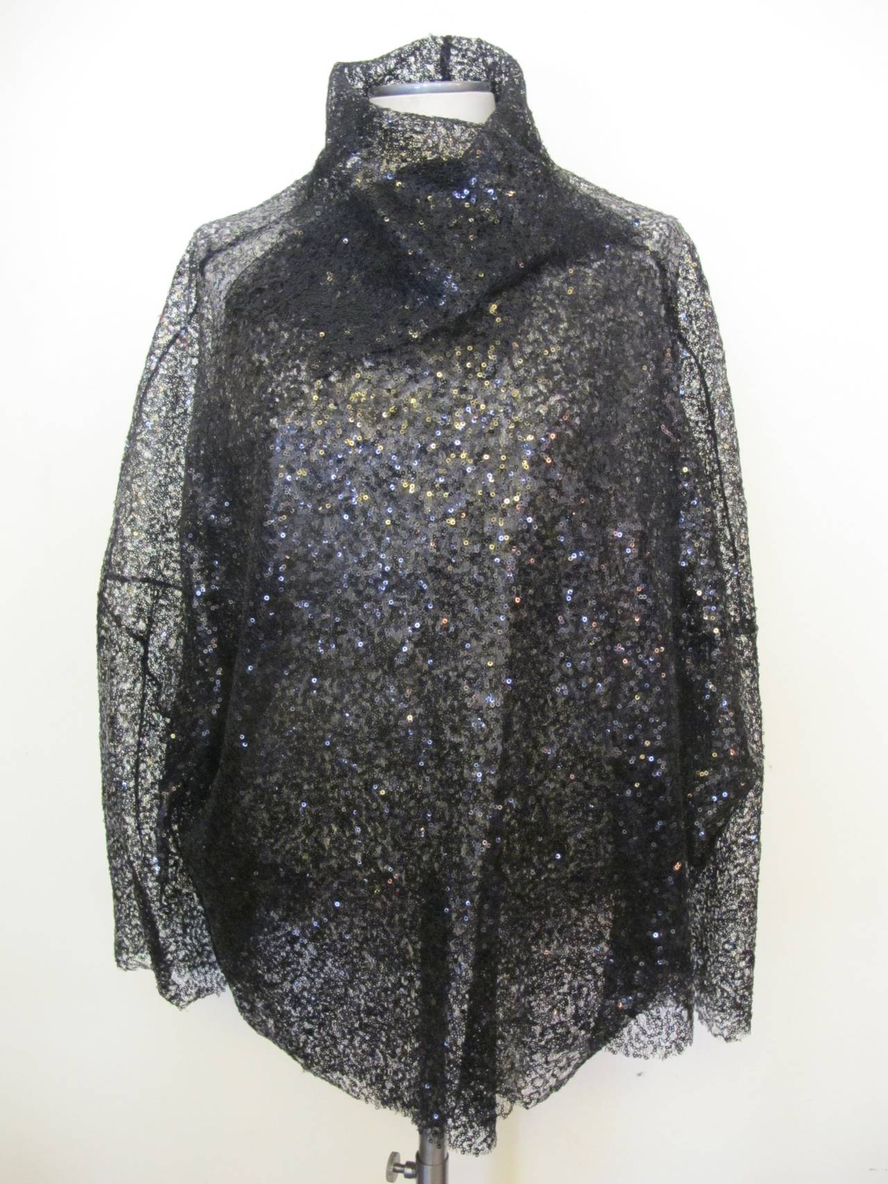 Ivan Grundahl drop shoulder mini black sequin jacket with raw edges. The jacket is one size and will fit size 10 to 16.