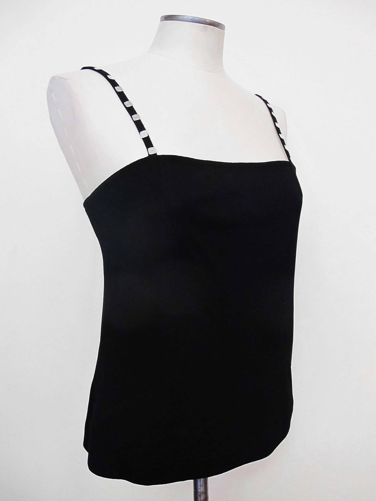 Black tank top with square silver sequins on straps. This piece is from the 1980's and was donated to Helpers by San Francisco's chic store: 
Wilkes Bashford