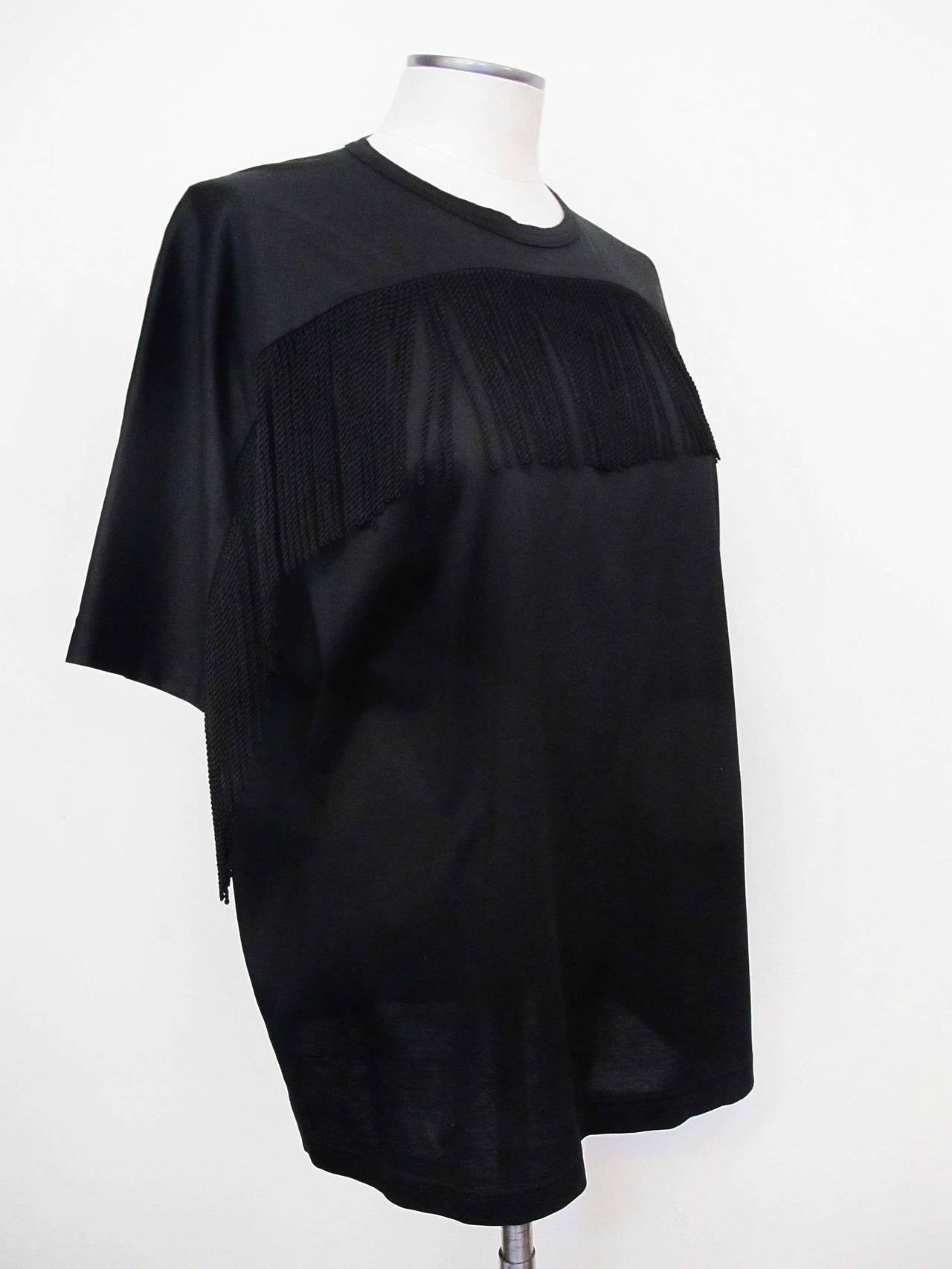 Junya Watanabe combination black T-Shirt and Blouse with continuous short sleeve. A 4.5 inch fringe captures the front of the blouse. Shoulder to shoulder measures 30 inches.