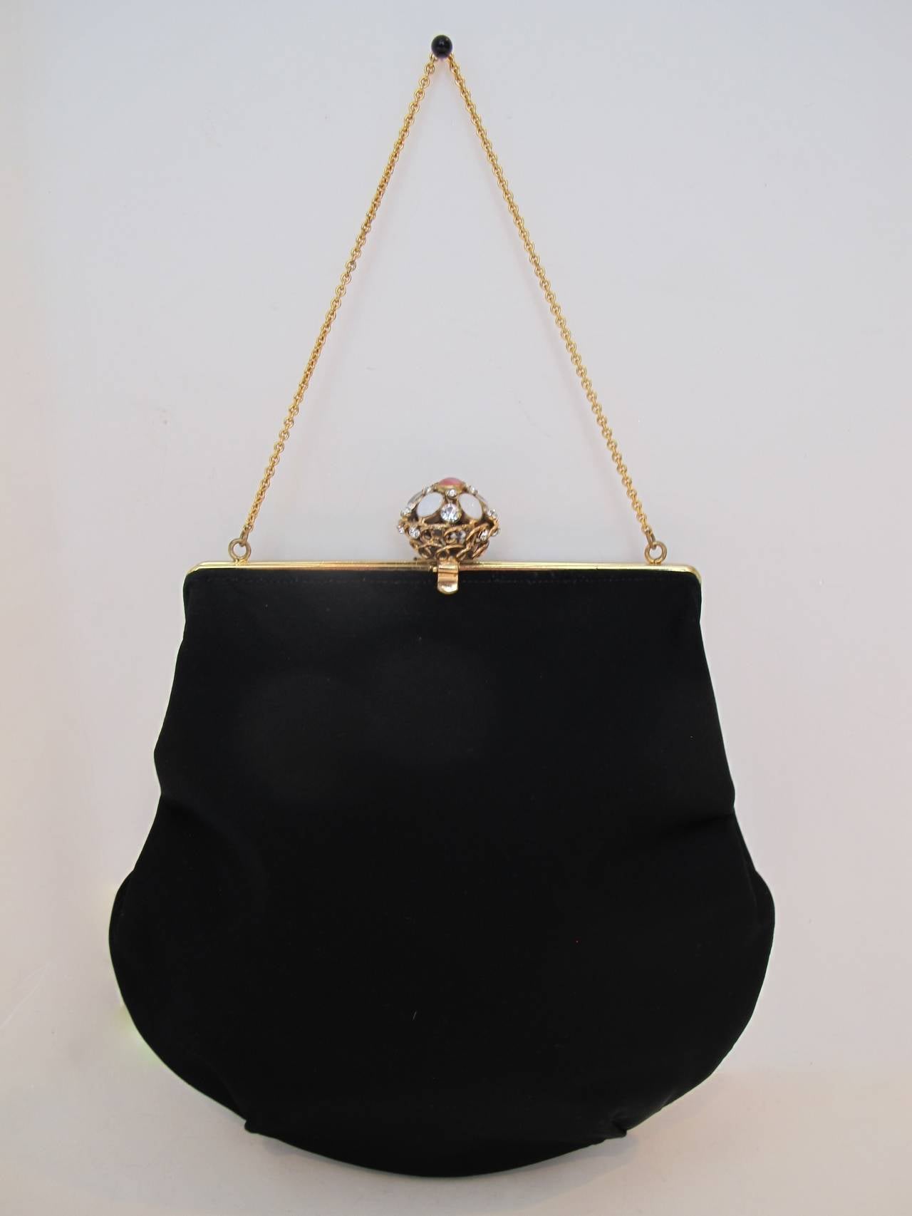 This is a rare, sophisticated Koret black satin hand-bag from the 1950's. During the 1950's, 1960's and 1970's, Koret was an exclusive elegant purchase and the quality and chic bags were purchased at Bergdorf Goodman, I. Magnin, Ransohoff's and