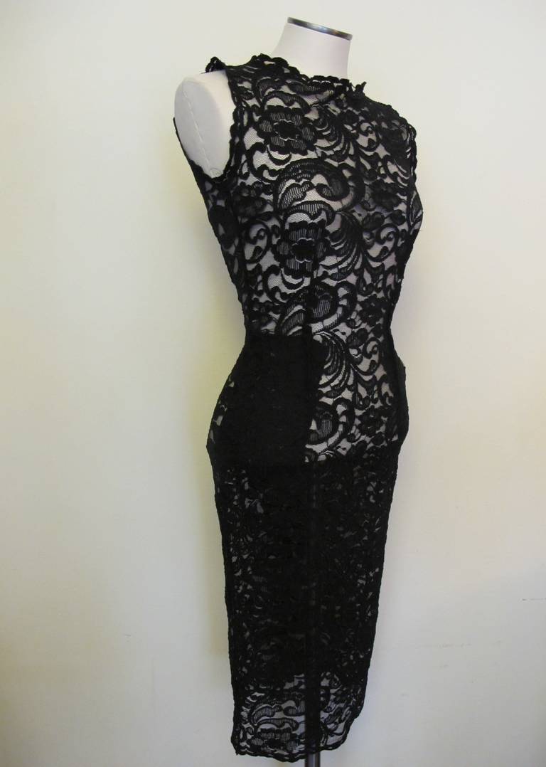 This exquisite new Pierre Balmain dress resonates classic elegance with a body-con look. The alencon lace is exquisite because of the longer length it can worn at a cocktail or black tie event. It is  fashioned with a scoop neck and elasticized lace