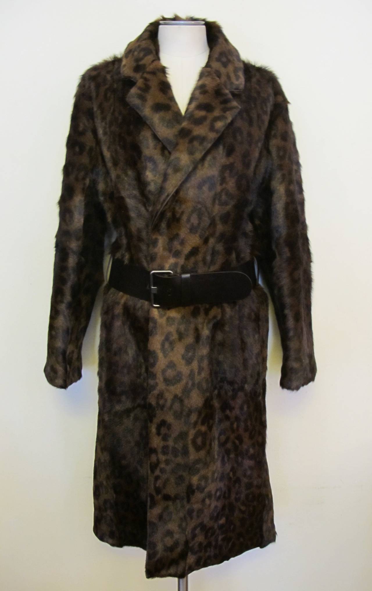 Over the Top Tom Ford chic leopard Winter Coat is oversize and cinches around the waist with a leather belt which is 39.75 inches in length and fits waist size 32, 33 or 34. The width of the belt is 2.25 inches. Original Price: $13,150.00. 
Helpers
