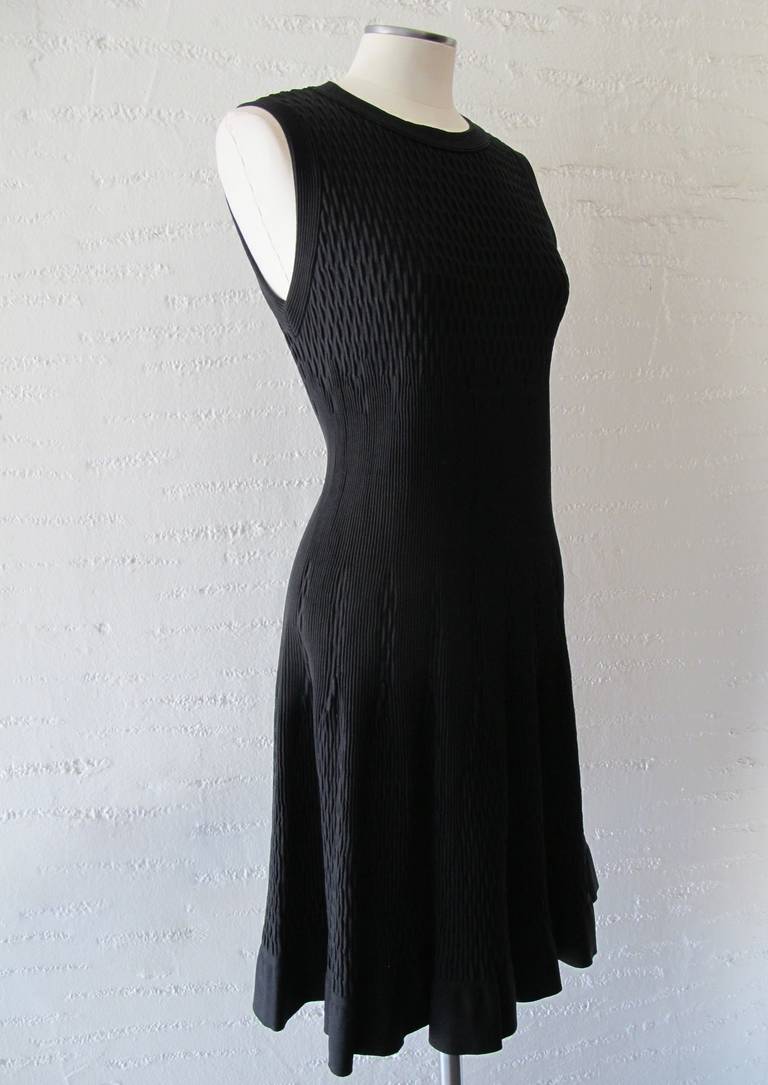 New Azzedine Alaia Barney's classic dress with tight knife pleating in 3 different designs throughout dress. The fabric on this elegant Alaia dress is fabulous and hugs the body in an ethereal way for day or evening. The bottom border of the piece