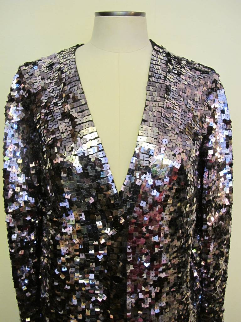 Elegant silver-lavender square sequin long evening jacket... perfect for cocktail and black tie events. The straight cut of the jacket is simply elegant and captures the beauty of the colored sequins. The stretch fabric lends to the beauty and