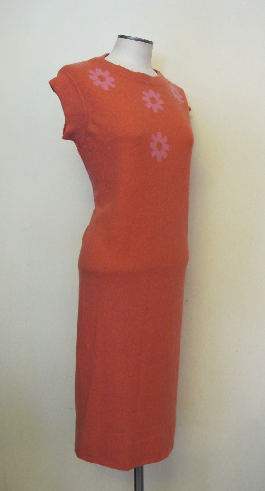 This new, never worn cashmere dress was donated to Helpers a charity helping those who are developmentally disabled by a fashion icon. Cashin worked for the Scottish Cashmere company, Ballantyne from 1964 to 1968. Deep pink daisies adorn the bodice