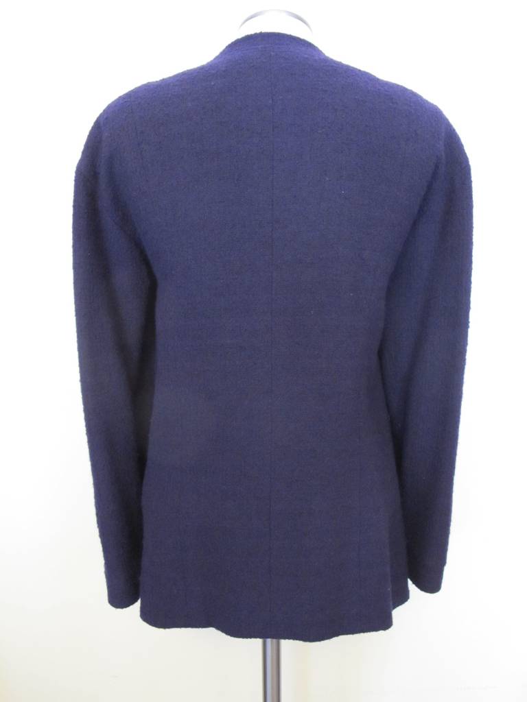 Chanel Navy Blue Boucle Jacket which fits size 14 to 16. It is classic, iconic and elegant. Sleeve length 21 inches. Shoulder to shoulder 21 inches.