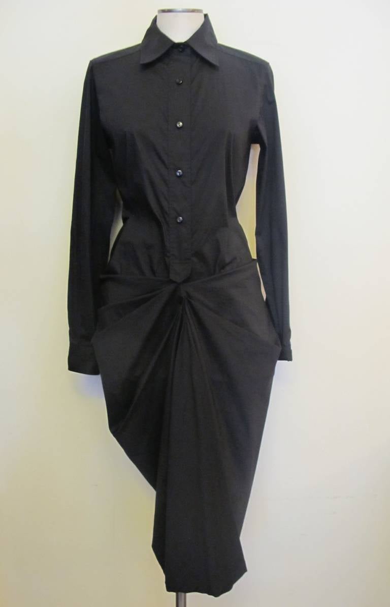 Avant Garde Max Mara dress inspired by Yohji Yamamoto. There are five buttons on the 17 inch tab. The elegant chic drape is formed by pleats and moves to the right and left on the lower part of the dress. It is so chic on the body. Sleeve length