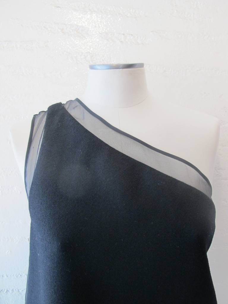 Stunning Stella McCartney One Shoulder Black Cocktail Dress. Trim on top of the dress is one inch silk organdy and continues to the measurement of 2.5 inches on the sides of the dress. The dress when worn makes an elegant, chic fashion statement.