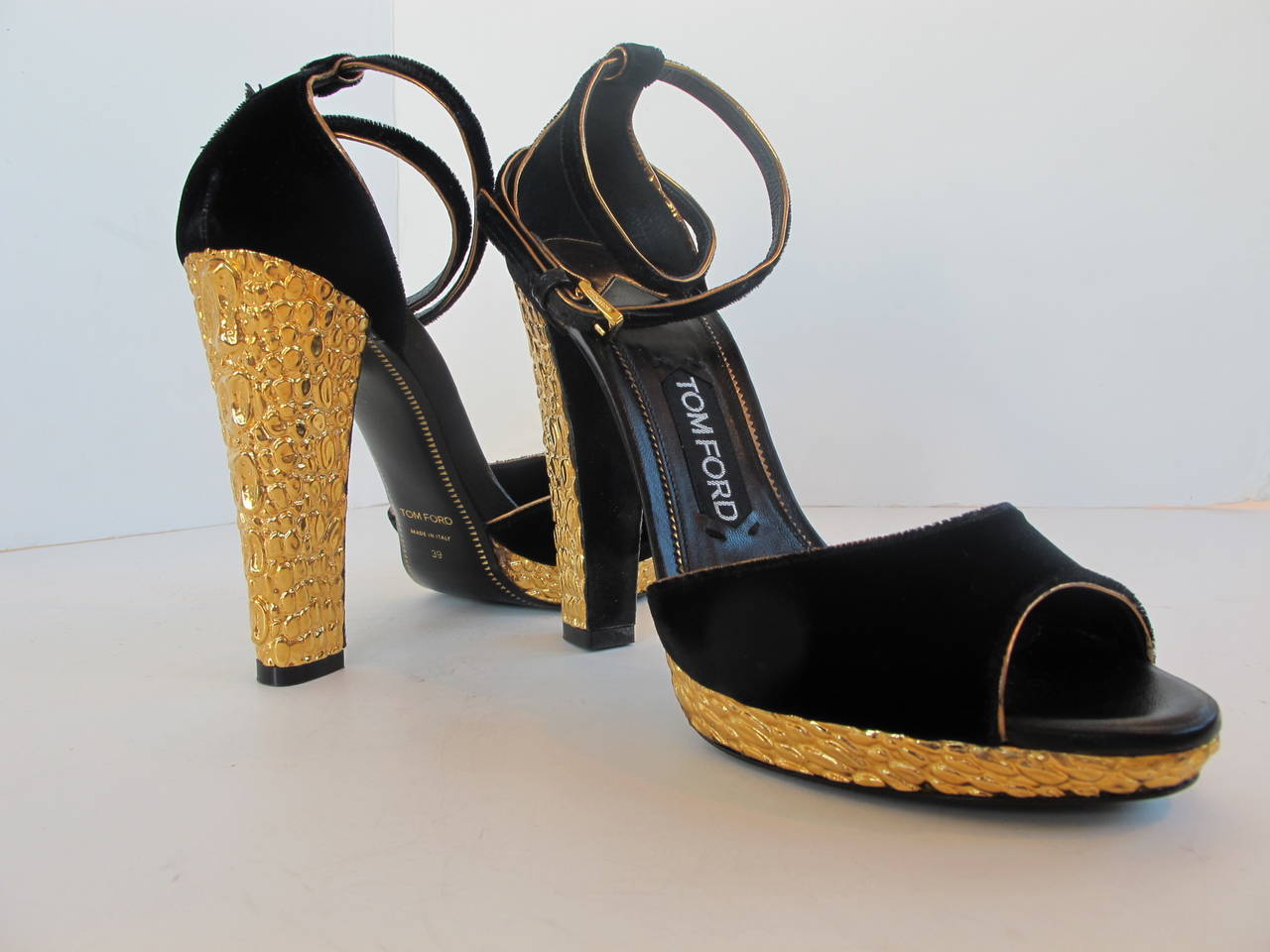 Over-the-top Tom Ford Sandals with gold metal with embossed alligator on metal. 5 inch heel. Platform 1/2 inch.